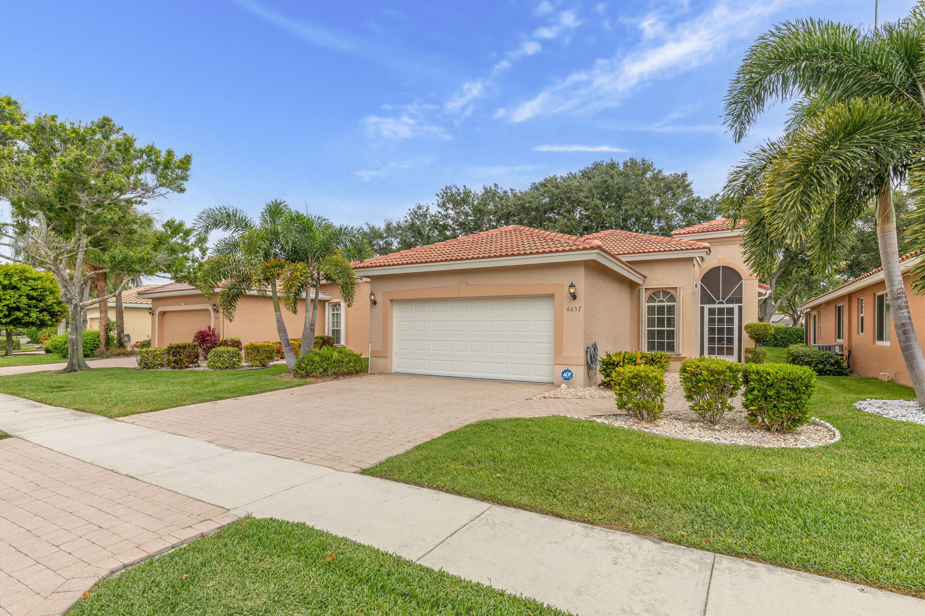 Pristine, light &bright, this beautifully UPGRADED home features a BRAND NEW ROOF 2025  & a full suite of high end additions, including new wood kitchen cabinetry with granite countertops & a stylish backsplash, plantation shutters, upgraded baths with quartz countertops, new cabinetry & frameless shower doors, new flooring throughout, & elegant crown molding with upgraded baseboards. Accordion shutters & wide open floorplan.Perfectly positioned in a premier cul de sac location in the community, this residence is just steps from the clubhouse and all amenities, offering unmatched convenience and a truly exceptional setting. Ammenities include: pickleball,tennis, fitness center, grand ballroom,billiard, hobby & card rooms, large resort style pool & more. The Association fees include Maintenance of Landscaping: Residential & Common Areas, Operation of the Clubhouse, Painting the house, Cleaning the roofs, Residential Basic Cable TV & Security Alarm Services, and Maintenance of the amenities.