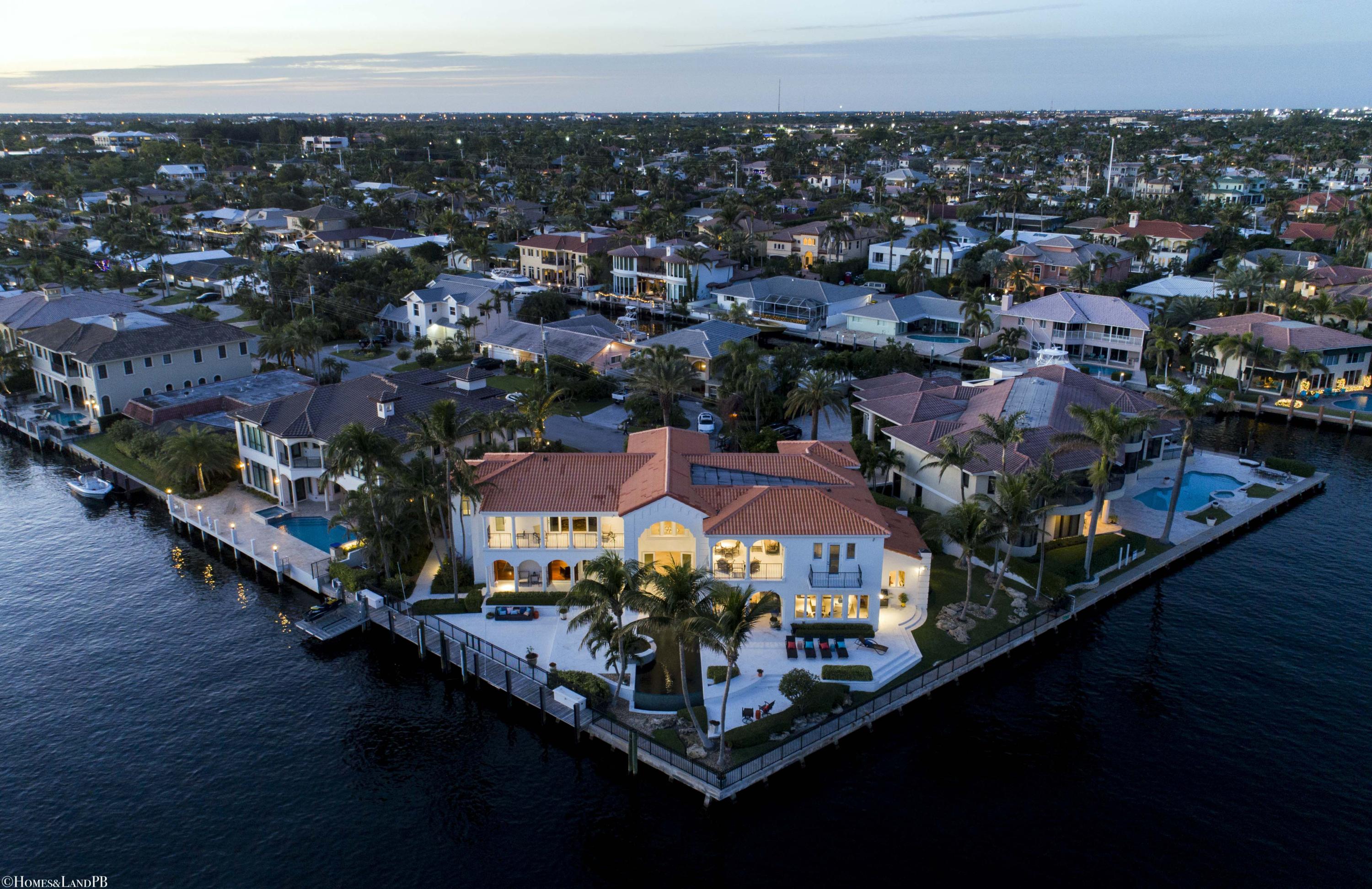 Spectacular South East Intracoastal Point Lot Mansion. Tuscan inspired point lot Mega Mansion! 227 seawall, 122 side canal dockage. Infinity pool & spa, fireplace, gourmet kitchen, library, elevator and loft area, 4-car garage, Smart House! Upgrades to property as per the owner: 

5 newer a/c units 
interior repainted in 2015 
exterior repainted in 2016 
new pool heater 
dock electric upgraded for 90 ft lot 
new jet ski lift 
natural gas line run to front of house 
all stone floors and shower refinished in 2015