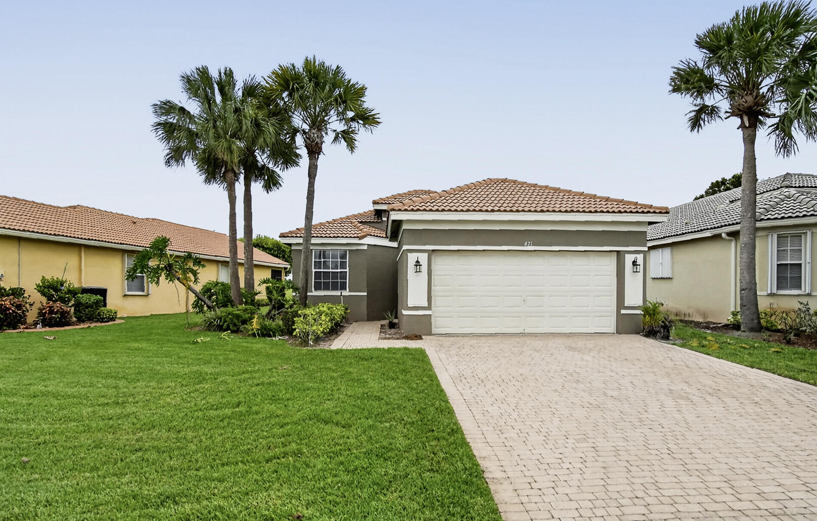 Available for immediate lease! 3/2/2 in desirable St. James Golf Club. Well-maintained and freshly painted w/a neutral backdrop. Light and bright split floor plan w/soaring volume ceilings, wood-look tile floors, an eat-in kitchen, spacious great room, and dining area. Spacious primary suite offers dual walk-in closets and a roomy bathroom w/separate tub and walk-in shower. The second bathroom has been stylishly renovated! Enjoy scenic views of the 16th fairway from your covered patio. Community amenities include a clubhouse, resort-style pool, fitness center, playground, tennis courts, and more. Rent includes lawn care, basic cable, and internet. Located just minutes from I-95, shopping, dining, Mets Stadium, and the beautiful beaches of Hutchinson Island!