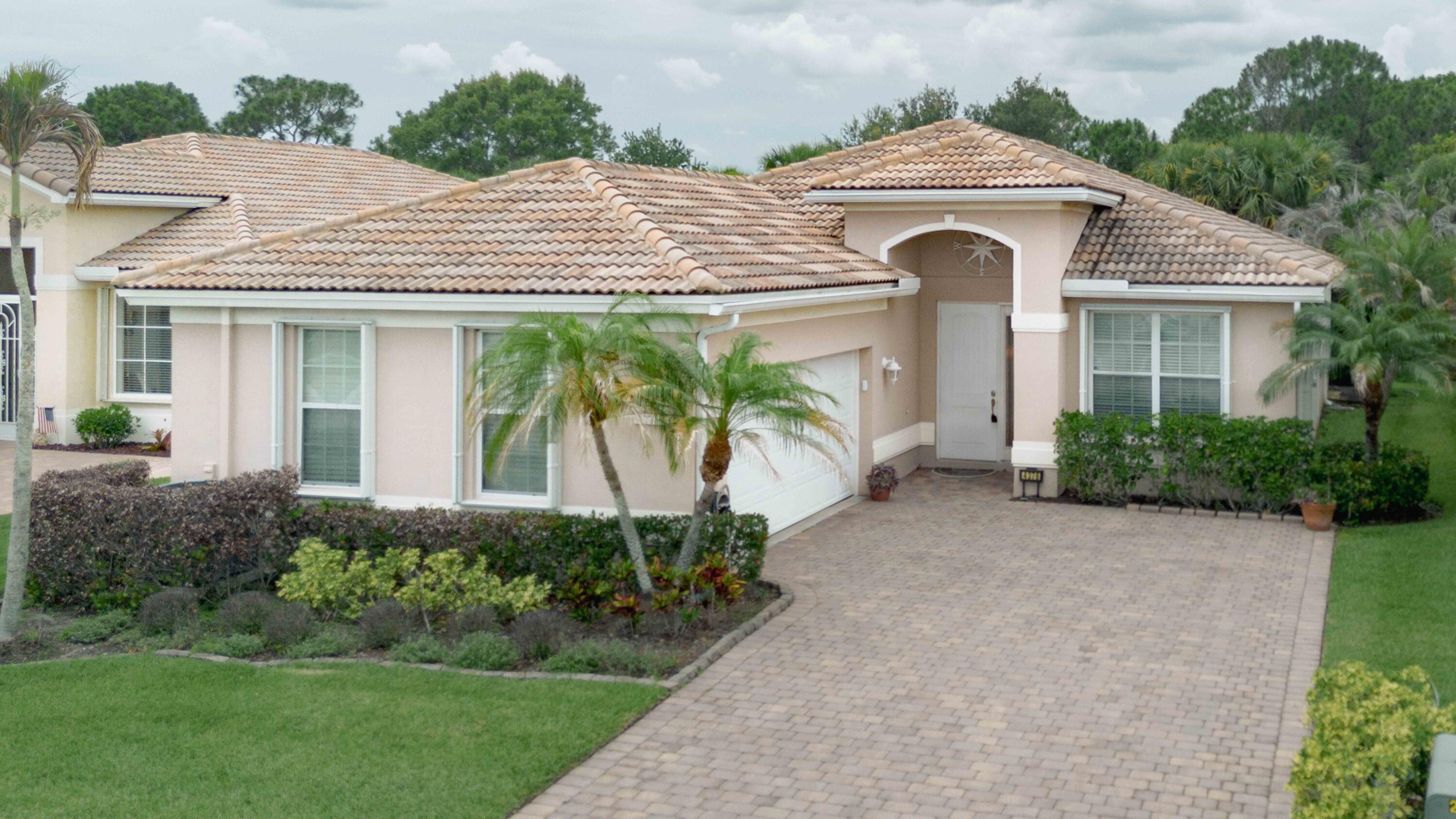 Wonderful home located in the secure and popular neighborhood of Jensen Beach Country Club where you can enjoy carefree country club living without a mandatory golf membership. This CBS home has 3 bedrooms, 2 baths. Built in 2011. Home has accordion shutters for storm protection. New A/C in 2025. Brand new washer. Glass enclosed rear patio for additional living space. Screened lanai with serene views. Resort-style living includes 3 heated pools, clay tennis and pickleball courts and a pay and play golf course with dining. HOA includes lawn/landscaping, cable/internet, and security monitoring, common areas, recreation facility, pool service. There is an on-site restaurant in the Golf Clubhouse that is open to residents. Home has a beautiful open floor plan with high ceilings, split plan.