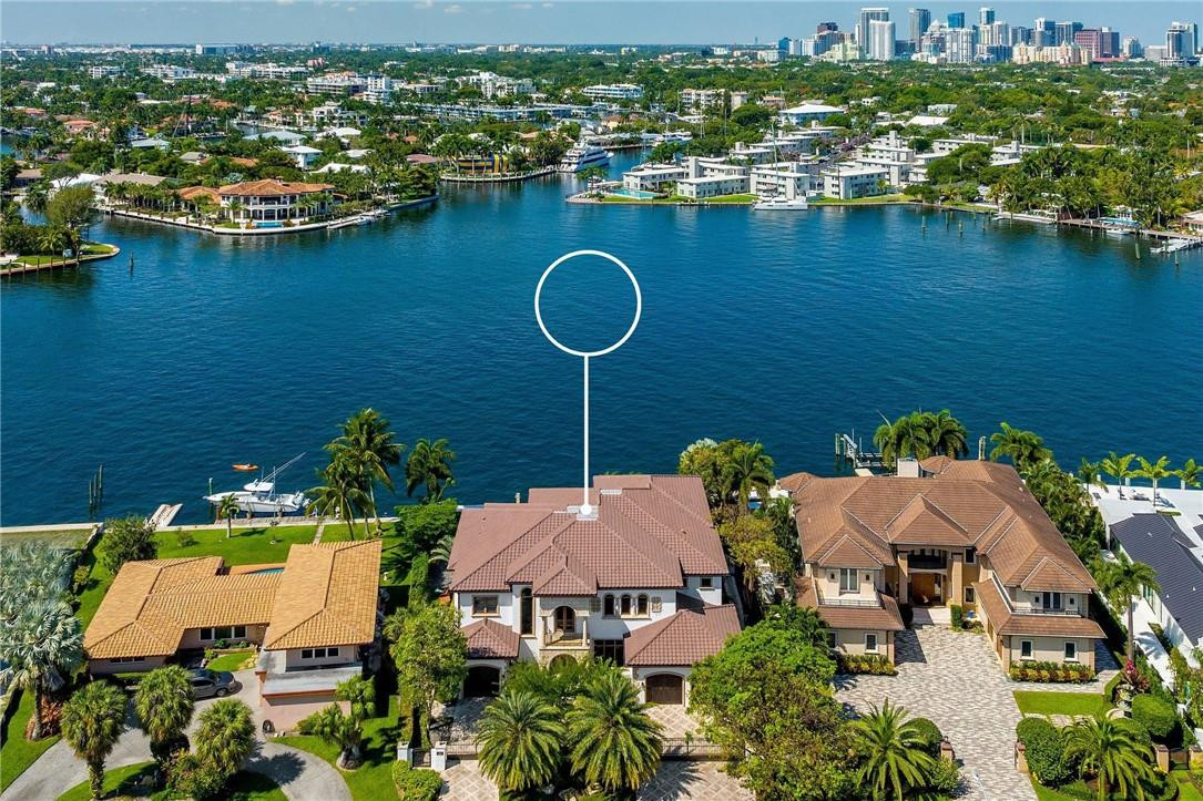 Timeless Mediterranean style home in the coveted & gated Sunrise Intracoastal neighborhood! Situated on the Middle River, this beautiful estate has wide open water views. Luxurious finishes & features throughout including coffered ceilings, eat-in kitchen w/high end appliances & breakfast nook open to the family room, Sonos sound system, elevator, theater, generous en-suite guest rooms & generator. Expansive primary suite includes water views, sitting area, bath w/dual sinks & water closets, soaking tub, rainfall shower w/jets & vast covered balcony w/hot tub. Resort style backyard w/expansive lawn, pool & summer kitchen. Large covered veranda to enjoy the views, sunsets & sunny breezy weather. 105' of water frontage w/mega yacht dockage, including docking your 70' Yacht Stern-in!