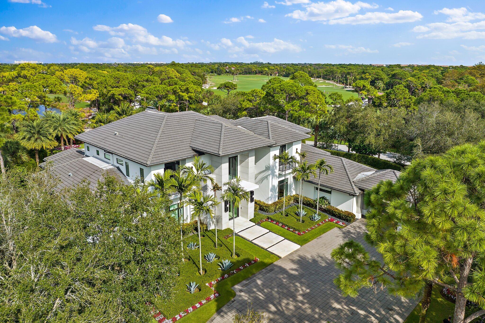 Experience the pinnacle of luxury living with this contemporary estate at 103 W Bears Club Drive. Situated in The Bears Club, a prestigious gated community just 1 mile from Atlantic beaches, this 9,100 sq ft home seamlessly blends indoor and outdoor living. Enjoy resort-style living with a luxurious pool and a summer kitchen.

Nestled on nearly 400 acres and home to a Jack Nicklaus signature golf course, The Bears Club offers exclusivity with only 61 estate homes. This property boasts 5 bd, 6 bath, 4 car garage, guest house, club room, and an exquisite great room kitchen.

Discover the epitome of elegance and convenience, with top-notch amenities, including restaurants, shopping, medical facilities, and easy land and sea travel, all within reach.