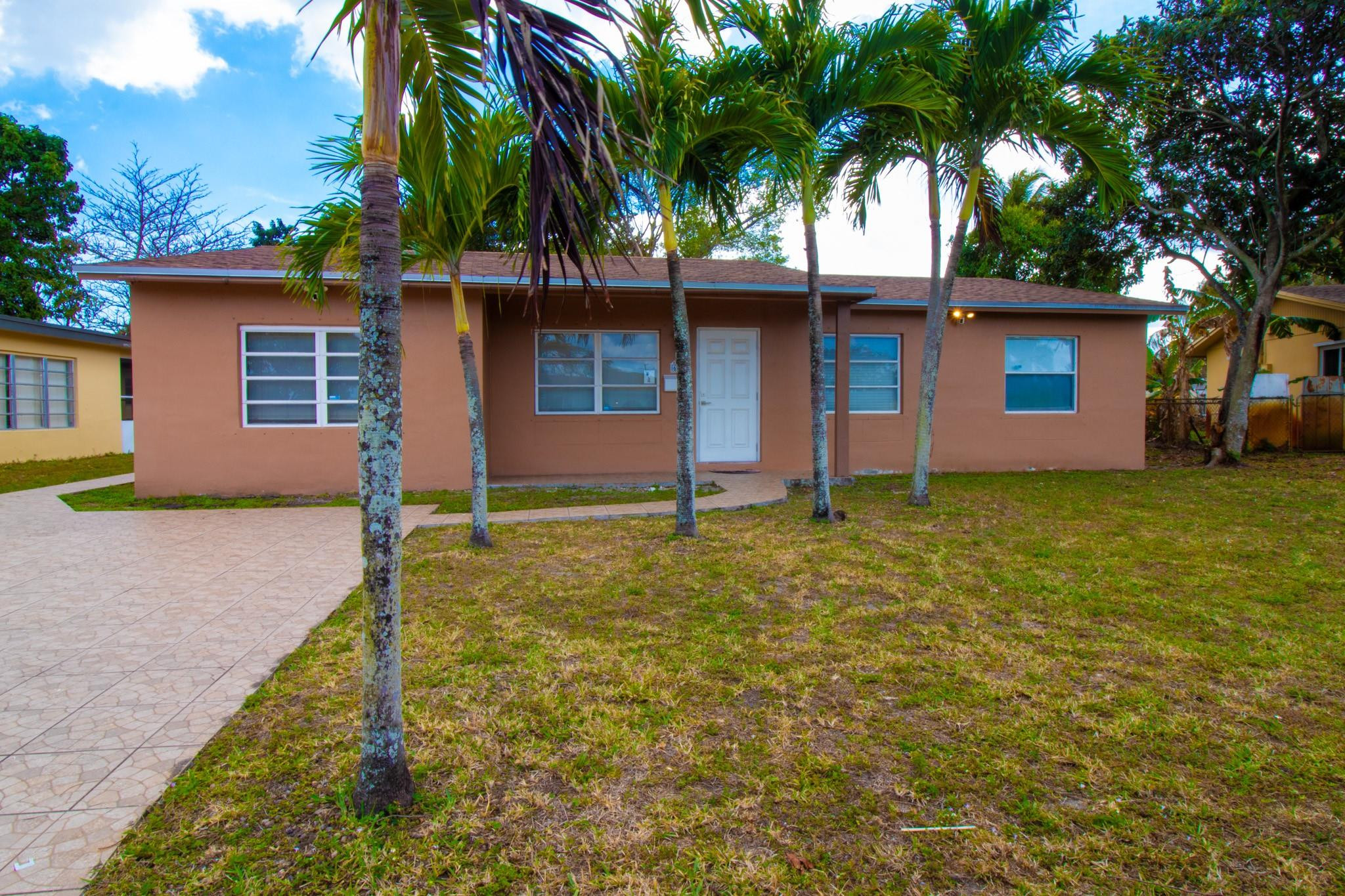 Located in the heart of North Lauderdale, 3-bedroom, 2-bath single-family home offers comfort, and all with NO HOA! The home features updated bathrooms with modern finishes. Enjoy peace of mind with a brand-new roof, adding long-term value and insurance benefits. Situated on an oversized lot, this property offers plenty of outdoor space for entertaining, gardening, pets, or even adding a pool. The expansive backyard provides endless possibilities to create your own private oasis. Conveniently located near schools, parks, shopping, dining, and major highways, this home combines suburban comfort with everyday convenience.