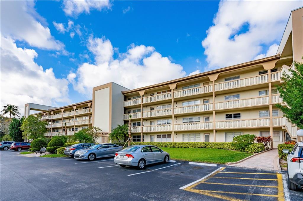 BEST VIEW IN WYNMOOR- MAGNIFICENT PANORAMIC GOLF/LAKE VIEW. BRIGHT NORTH/EAST EXPOSURE TOTALLY REMODEL UNIT, NEW APPLIANCES ,,KITCHEN CABINETS, GRANITE COUNTER TOP, TILES THRU-OUT. RENOVATED  BATHROOMS ,NEWER WATER HEATER AND A/C. PATIO HAS HURRICANE IMPACT WINDOWS..GATED COMMUNITY. ASSOC REQUIRES ONE OCCUP BE 55+.