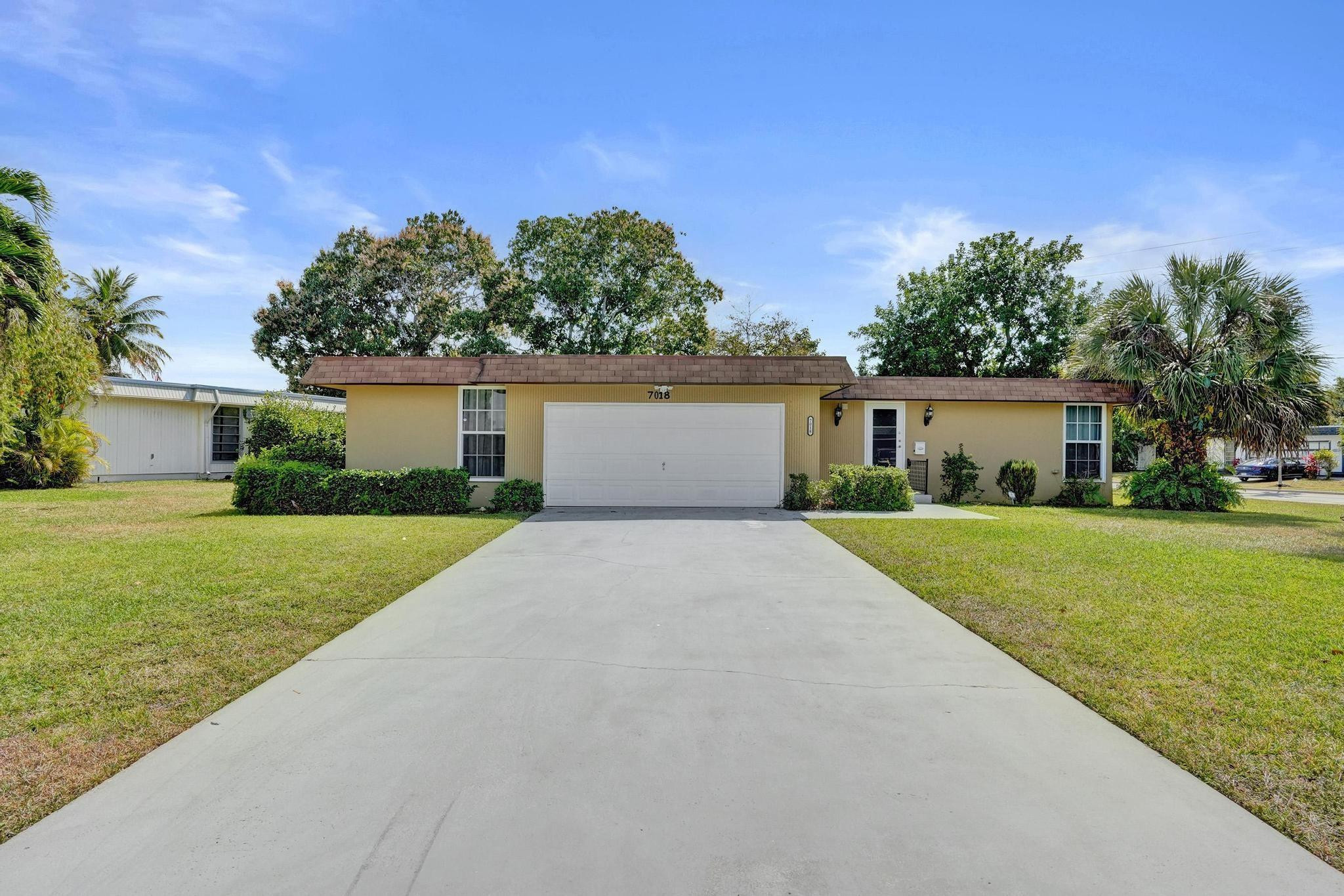 Tamarac Mainlands 2 Bedroom 2 Bathroom Corner Oversized Lot Water View Home. Roof 2018, Impact Windows, Updated Kitchen, Updated Bathrooms, New Tile Flooring, Updated Garage Door, Maintained Community, All Ages Community. Low HOA! HOA covers lawn maintenance, lawn pest control, sprinkler maintenance, pool, clubhouse.