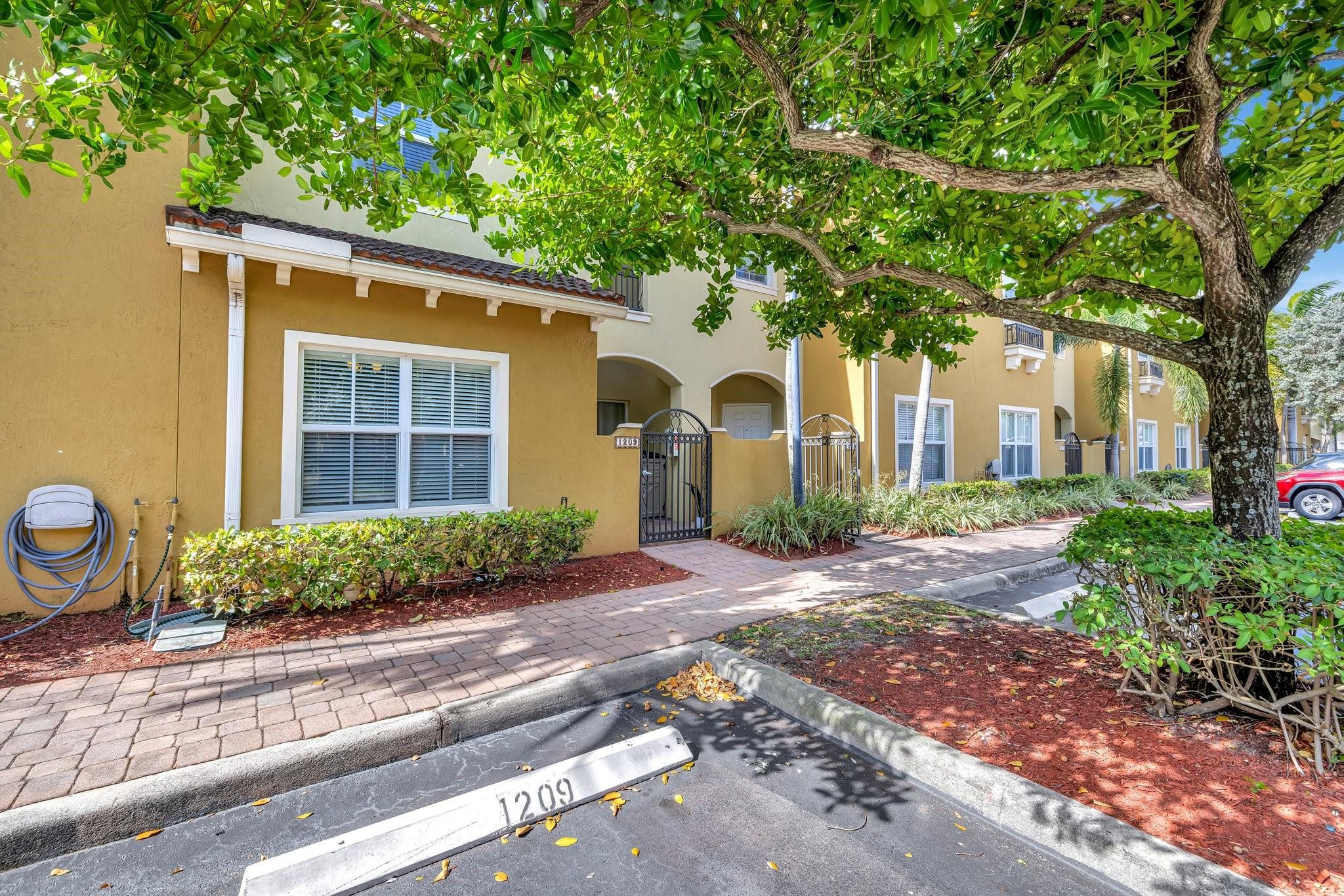 This move-in-ready 2-BEDROOM 2.5-BATHROOM TOWNHOME offers quiet water views and total privacy in a secure gated community. The layout is perfectly designed for dual living, featuring two spacious upstairs bedrooms that both serve as private suites with en-suite bathrooms. The main floor includes easy-to-maintain tile throughout and an open kitchen with granite countertops and ample storage.  Major updates provide total peace of mind, including a *brand-new 2026 AC and a 2020 water heater. The second floor features a dedicated laundry room and a massive walk-in storage area. The association covers the roof, water, Insurance and all common areas with no assessments. Enjoy the community pool and electric gate in this well-kept, pet-friendly neighborhood. Clean, turnkey, and very easy to show.