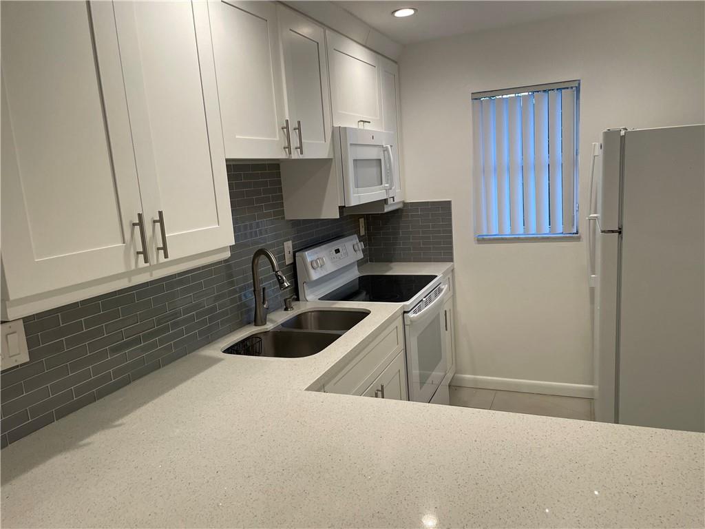 Great location , unit completely updated , floors , kitchen , new a/c , water heater , new recessed lighting , new electrical  system,  master bathroom , appliances , washer in the unit , brand new a/c ducts, roof about 7 years old