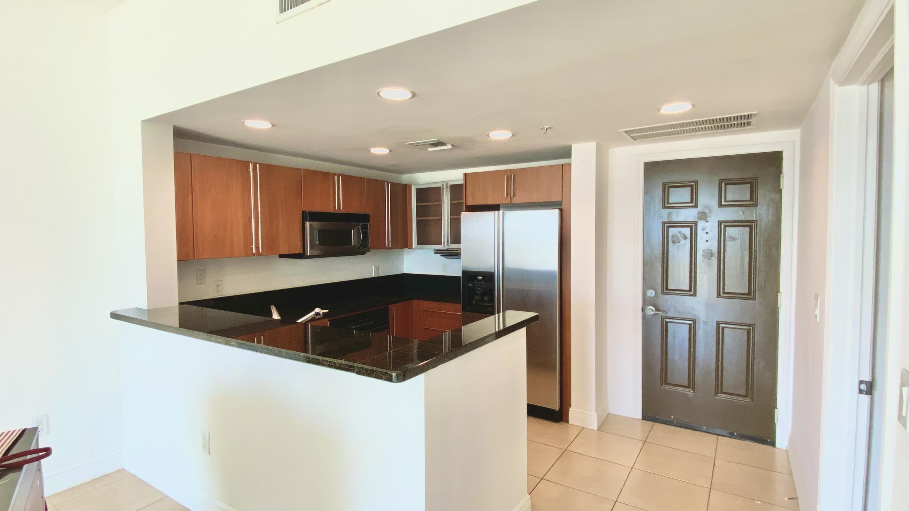 Full Service luxury PENTHOUSE 2BR/2BA on the 8th floor at 610 Clematis Street in the heart of downtown West Palm Beach. This unit features a modern kitchen with granite countertops and stainless steel appliances, flowing into a spacious living area with high floor-to-ceiling sliding doors that lead to a private balcony with city views.   Split-bedroom layout for added privacy.   Pool, Fitness Center, Sauna, Zen Garden with 2 Grills, Garage, 24/7 Front Desk Attendant. Steps to City Place, Intracoastal, Shopping, Fine Dining, Kravis Center, Convention Center, Brightline, The Green Market and Publix. Minutes to Palm Beach Island, Beach, Airport. Perfect for those looking to live in the center of downtown.   Newer AC and water heater.   TWO (2) UNDERGROUND Parking Spaces