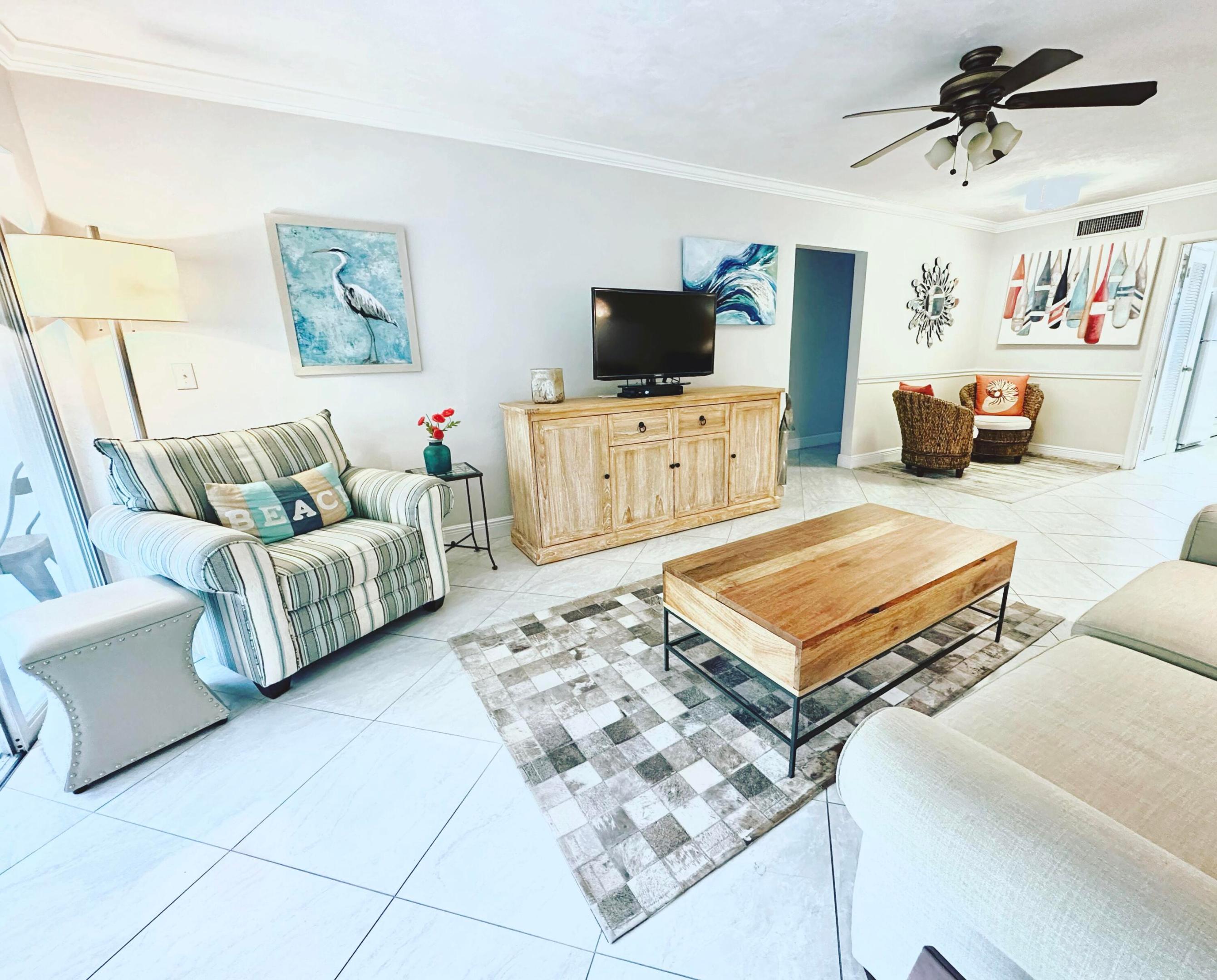 Well maintained 2 bedroom 2 bathroom condo in a 55+ community offers peaceful garden views from a bright and open Florida style porch with sliding glass doors that gives the home a lifestyle you can enjoy year round. A little walk from the unit you can take a swim in the two pools, enjoy the clubhouse, shuffleboard, putting green, library, and grill area.  Laundry and storage are located right next to unit. Low HOA fees include exterior maintenance, landscaping, and access to all amenities.  Ideally situated within walking distance to popular restaurants, coffee shops, shopping, and the Tequesta Farmers market. Famous Jupiter Blue water Beaches are just a few minutes away. This is a wonderful opportunity for comfortable, low maintenance living in a friendly and welcoming community!
