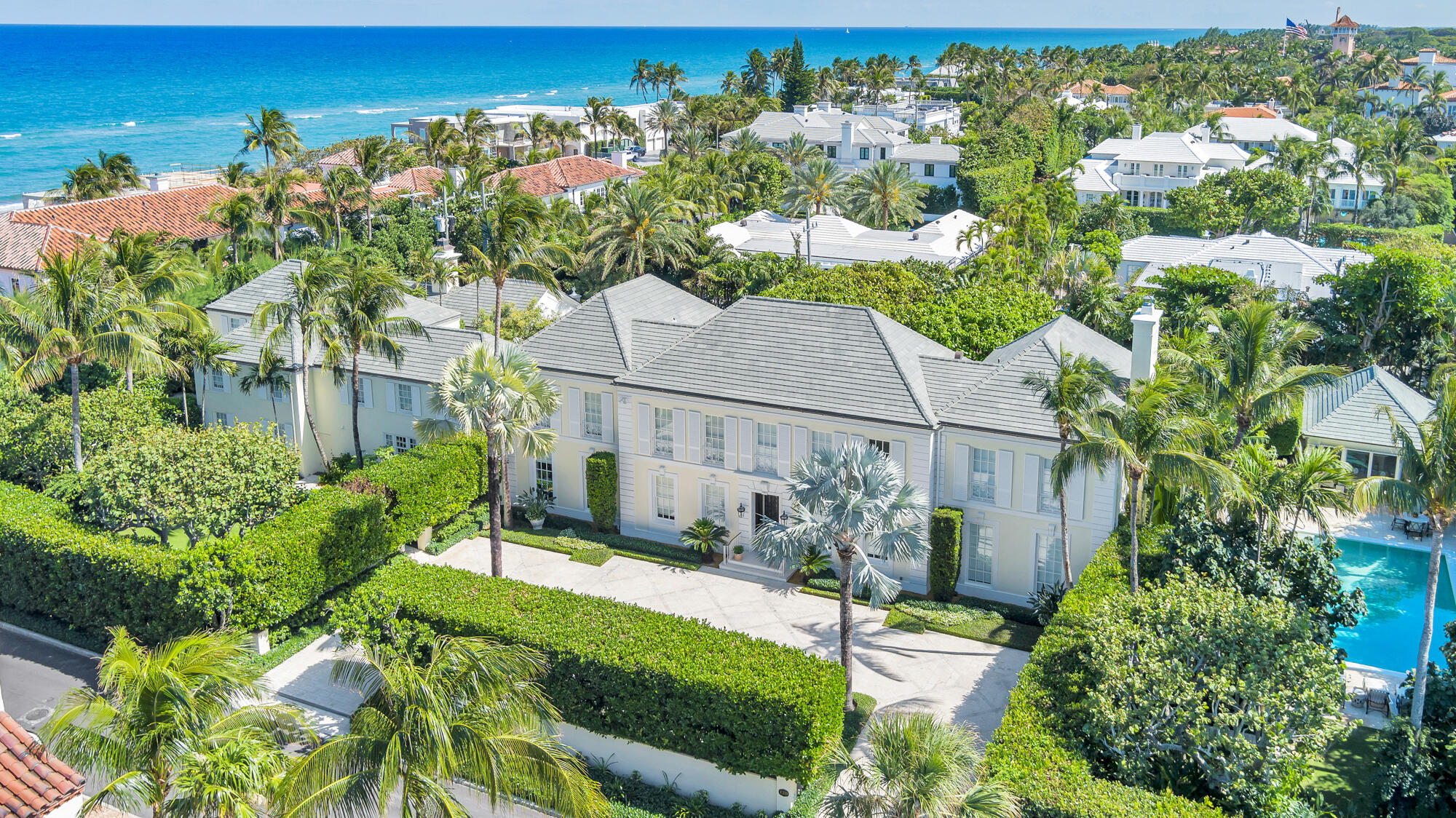 Welcome to one of Marion Sims Wyeth's classic Palm Beach masterpieces. Situated on nearly an acre in the Estate section of Palm Beach, this 13,000+ square foot home exudes true precision in its design. The main home is comprised of 7 bedrooms, 9 bathrooms and 4 powder rooms, elevator with grand living spaces both indoor and outdoor. The formal dining room overlooks the gardens and loggia which are perfect for entertaining. Guests will experience ultimate privacy while staying in the separate guest house featuring custom woodwork throughout.  The outdoor spaces feature some of Mario Nievera's greatest work with breathtaking outdoor gardens, mature seagrapes and elegant coconut palms surrounding the property. In addition to the gardens there is patio featuring a 40' x 20' pool enclosed with lush greenery and a pool cabana creating a private and serene outdoor space.
