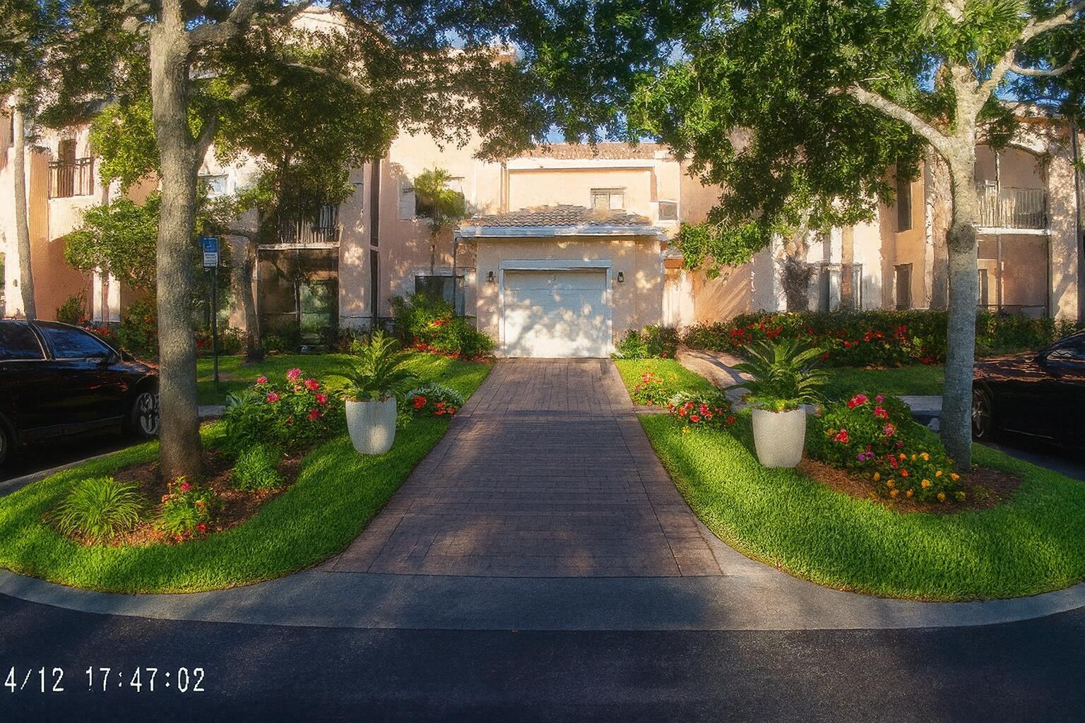 immaculate lakefront  town house with garage ,all granite kitchen and baths ,stainless new appliances, all new wood floors,  front n back patio , superb amenities including car wash