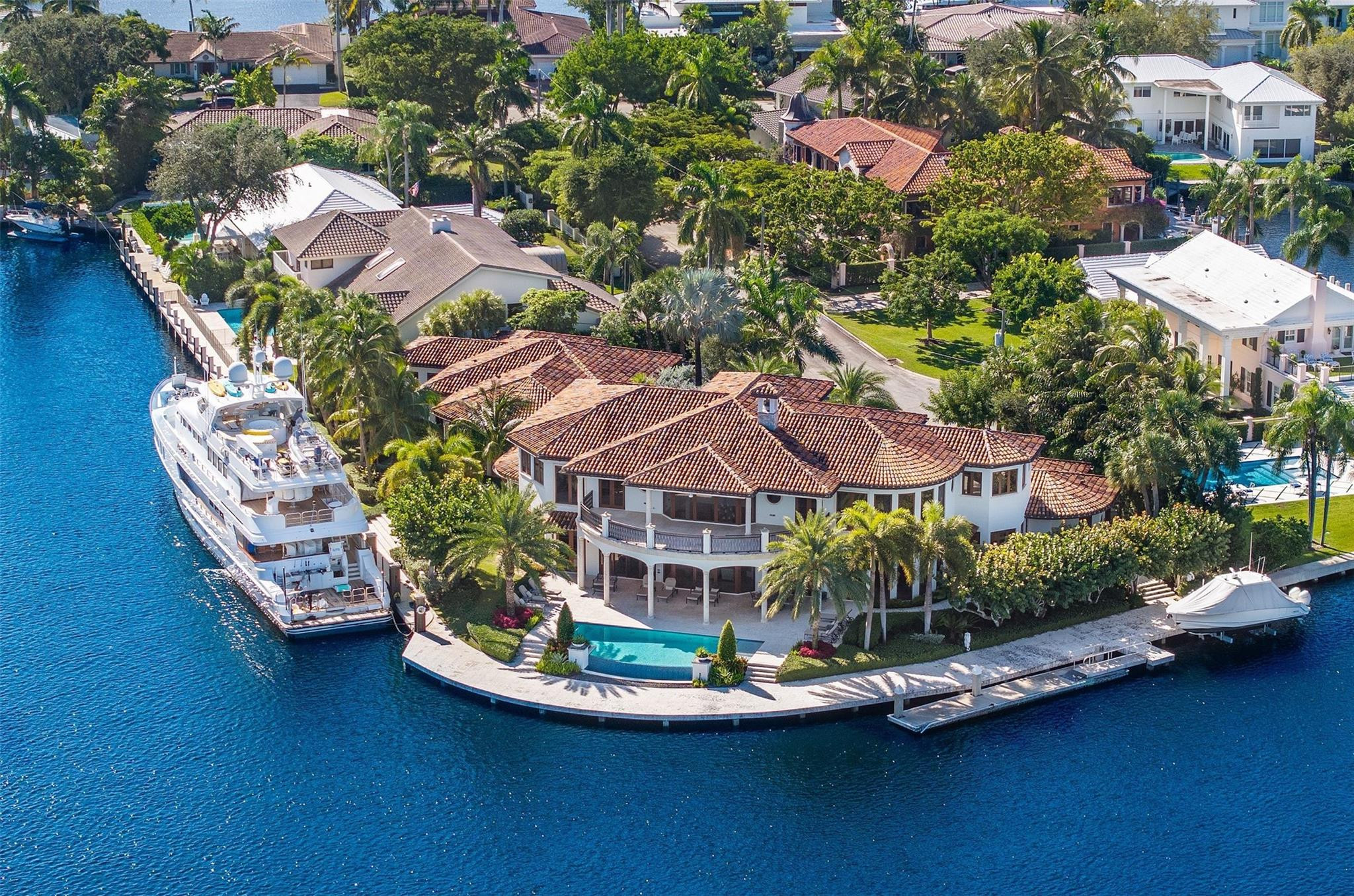 632 2ND Key Dr epitomizes the true meaning of a waterfront Estate. This masterpiece sits in the quiet & peaceful Sunrise Key neighborhood, on an expansive lot, nearing two-thirds of an acre, w/ 355' of prime WF and sweeping wide water views! Built by the esteemed Waterbrook Builders, find impeccable high-end finishes abound—from gleaming marble floors to soaring ceilings & floor-to-ceiling windows that frame breathtaking vistas from every room. The open-concept design flows effortlessly, ideal for hosting, w/ refined amenities including a dedicated wine cellar, media room, gym and sauna, elevator & a separate fully appointed guest house. Outside, an inviting infinity pool sits at the heart of the mega yacht dock, perfectly positioned to accommodate a prized collection of vessels.