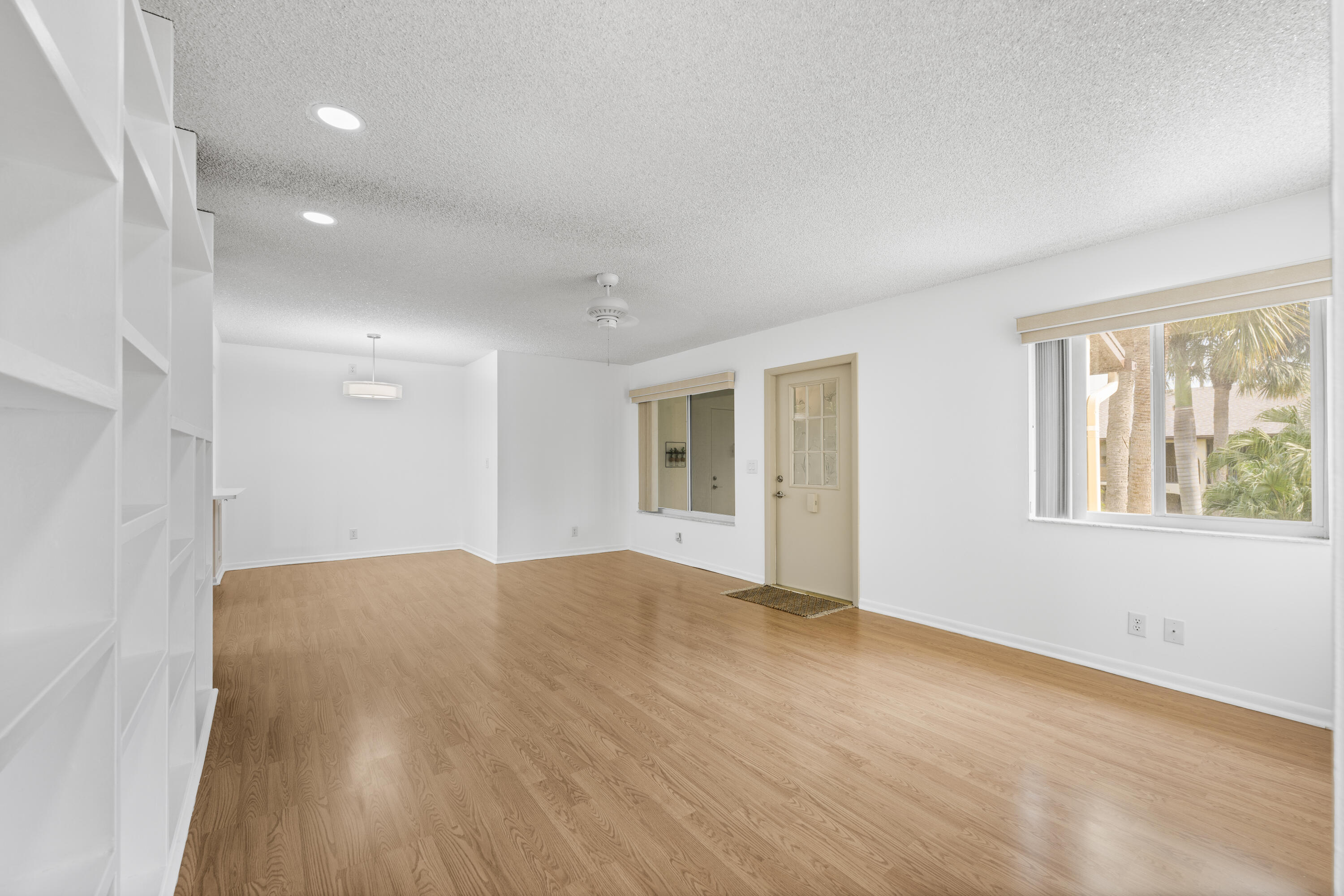 Beautiful, Bright & Move-In Ready! Welcome home to this fresh, bright, and impeccably maintained 2-bedroom residence in the highly desirable Pine Ridge III community in Greenacres a quiet, centrally located neighborhood close to everything! This charming CBS-constructed unit checks all the boxes: NEW 2024 roof (fully paid), NO assessment debt, all NEW windows, full accordion hurricane shutters (including the porch), and new stainless steel appliances. Truly move-in ready! Step inside to a naturally lit, freshly painted interior with no carpet, new light fixtures, an updated electrical panel, and an energy-efficient water heater. The spacious layout features an open living and dining area, a comfortable kitchen, an updated bathroom with solid-surface/granite countertops.
