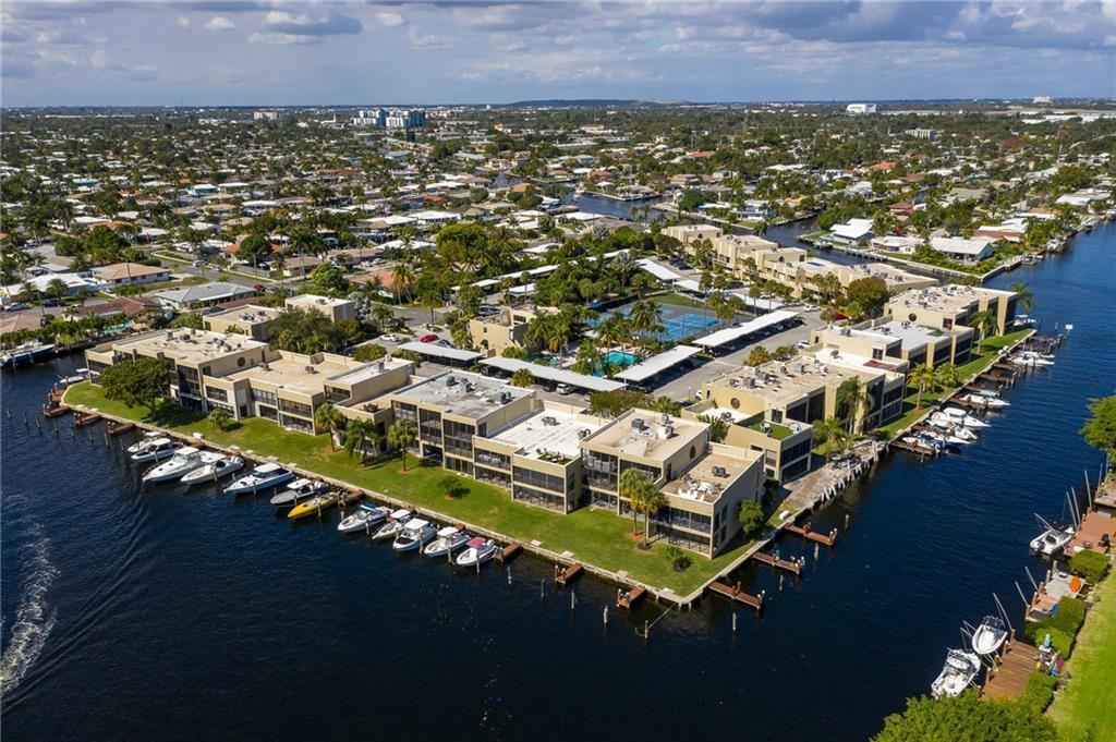 Take up the boating lifestyle with this beautiful 2/2 condo on the water with your own dock space! The home offers not only a great view overlooking the water from your privet balcony but also an updated kitchen, new laminate flooring in the bedrooms, along with a walk-in closet in the master bedroom that has built-in's. If you are looking for that resort feel while staying at home this properties amenities has what you are looking for. You have a great area to grill while lounging in the pavilion or take a dip in the pool/hot tub. How about a nice round of tennis or pickle ball? Maybe get a workout in at the gym. On top of all that you are just minutes from Pompano's beautiful beach area with great shopping and dining. Owner says bring offers!