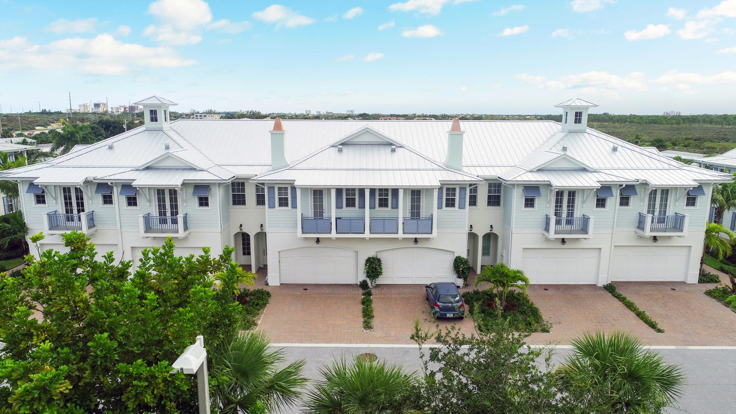 WALK TO THE BEACH & JUNO BEACH PIER!. Exquisite annual or seasonal rental. 3 bedrooms, 2.5 baths, 2 car garage. This beachside, Key West style, 2 story townhome is professionally decorated, offering wide open living space, fully equipped kitchen, SS appliances, glass backsplash, quartz countertops, large center island. Living area has bar with wine fridge, tile & wood flooring, carpet in bedrooms, 3 bedrooms on second floor with loft kitchenette & laundry room. Generous sized primary bedroom with 2 walk in closets, balcony & large shower enclosure in primary bath, dual vanities. Guest bath has shower/tub enclosure. Community pool. Offered Furnished. No pets, no smoking. Available September 1, 2026 and for Season 2027
