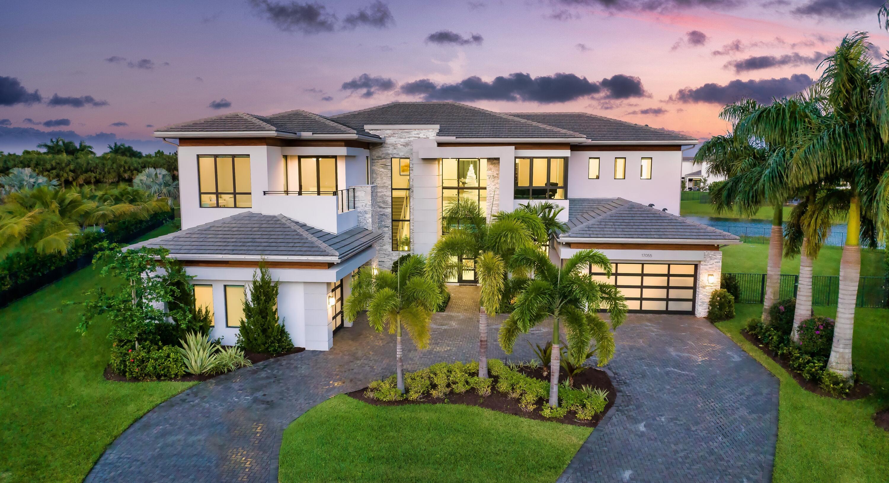 Boca Bridges Expansive Lakefront Estate 
 
Quietly tucked away in a private cul-de-sac and nestled on an oversized 0.72 +- acre lot, this coveted Vanderbilt Grand Contemporary model spans 11,873 +- square feet of exquisite living. Featuring six commodious bedrooms, eight full and two partial bathrooms, four car garage, custom and upgraded accents, and luxuriant outdoor living space, this sprawling pristine lakefront estate was constructed by the prestigious GL Homes in 2020 and is the largest model offered at Boca Bridges. Brulee Breeze Way, Boca Raton, Florida. Located in the heart of Boca Raton, Boca Bridges' centralized location allows residents easy access to upscale shopping, refined dining options, pristine beaches, museums, and top A-rated schools. 

Integrating the sophisticated grandeur of resort-style living with family friendly amenities, Boca Bridges offers 24-hour staffed security, lush foliage throughout the well manicured property, and scenic waterfront views. Featuring a lavish 27,000 +- square foot clubhouse, complete with state-of-the-art gym, yoga room, indoor and outdoor sports courts, and playground, this lucrative gated enclave offers a wide array of world-class amenities. 

Framed by stately palm trees and cast with verdant tropical flora, this estate's lush greenery and expansive waterfront views evoke serenity at every turn.  

This modern residence's sprawling and immaculately landscaped lot boasts a large outdoor entertainment space, oversized resort style pool, and state-of-the-art 1,000 +- SqFt poured concrete indoor sports center with central air (with the ability to be converted into a bedroom | flex space), creating the ideal space to indulge in and enjoy the fabulous South Florida lifestyle. 

Brimming with sophistication and clean-lined elegance, custom fixtures and details, high volume ceilings, and a striking custom chandelier mesmerizingly adorn this stunning estate's grand entry.
 
Brightened and filled with natural light, the beautifully appointed foyer opens into the home's formal living room space, providing an expansive view of the estate's spacious backyard, resort-style pool, lake, and natural preserve through lavish impact windows.  
Adjacent to the formal living room is the residence's spacious and custom modern kitchen which features opulent three-inch quartz waterfall countertops, custom vertical lift white gloss cabinets, and several top-tier appliances including Sub-Zero refrigerator, Viking gas range, and Wolf stacked ovens. 

This stylish grand estate's first floor also showcases an open concept family room; gorgeous formal dining space, media and clubroom, indoor sports court, including a custom bar and charming French doors that open to the pool and deck area and stunningly spacious yard.  

Upstairs, the primary suite opens to a chic wet bar with custom his and her walk-in closets at either side, large sitting room area, and a private patio overlooking the estate's striking serene outdoor space. The primary suite's capacious separate custom bathrooms encompass regal three-inch quartz countertops, frameless showers, and freestanding tub. 

Also on the second floor are the residence's remaining four ensuite bedrooms, a frosted glass enclosed loft, and laundry room.  

The estate is staged by Meridith Baer Home with furniture available for purchase. 
  

DISCLAIMER: Information published or otherwise provided by the listing company and its representatives including but not limited to prices, measurements, square footages, lot sizes, calculations, statistics, and videos are deemed reliable but are not guaranteed and are subject to errors, omissions or changes without notice. All such information should be independently verified by any prospective purchaser or seller. Parties should perform their own due diligence to verify such information prior to a sale or listing. Listing company expressly disclaims any warranty or representation regarding such information. Prices published are either list price, sold price, and/or last asking price. The listing company participates in the Multiple Listing Service and IDX. The properties published as listed and sold are not necessarily exclusive to listing company and may be listed or have sold with other members of the Multiple Listing Service. Transactions where listing company represented both buyers and sellers are calculated as two sales. The listing company's marketplace is all of the following: Vero Beach, Town of Orchid, Indian River Shores, Town of Palm Beach, West Palm Beach, Manalapan Beach, Point Manalapan, Hypoluxo Island, Ocean Ridge, Gulf Stream, Delray Beach, Highland Beach, Boca Raton, East Deerfield Beach, Hillsboro Beach, Hillsboro Shores, East Pompano Beach, Lighthouse Point, Sea Ranch Lakes and Fort Lauderdale. Cooperating brokers are advised that in the event of a Buyer default, no financial fee will be paid to a cooperating Broker on the Deposits retained by the Seller. No financial fee will be paid to any cooperating broker until title passes or upon actual commencement of a lease. Some affiliations may not be applicable to certain geographic areas. If your property is currently listed with another broker, please disregard any solicitation for services. Copyright 2023 by the listing company. All Rights Reserved.