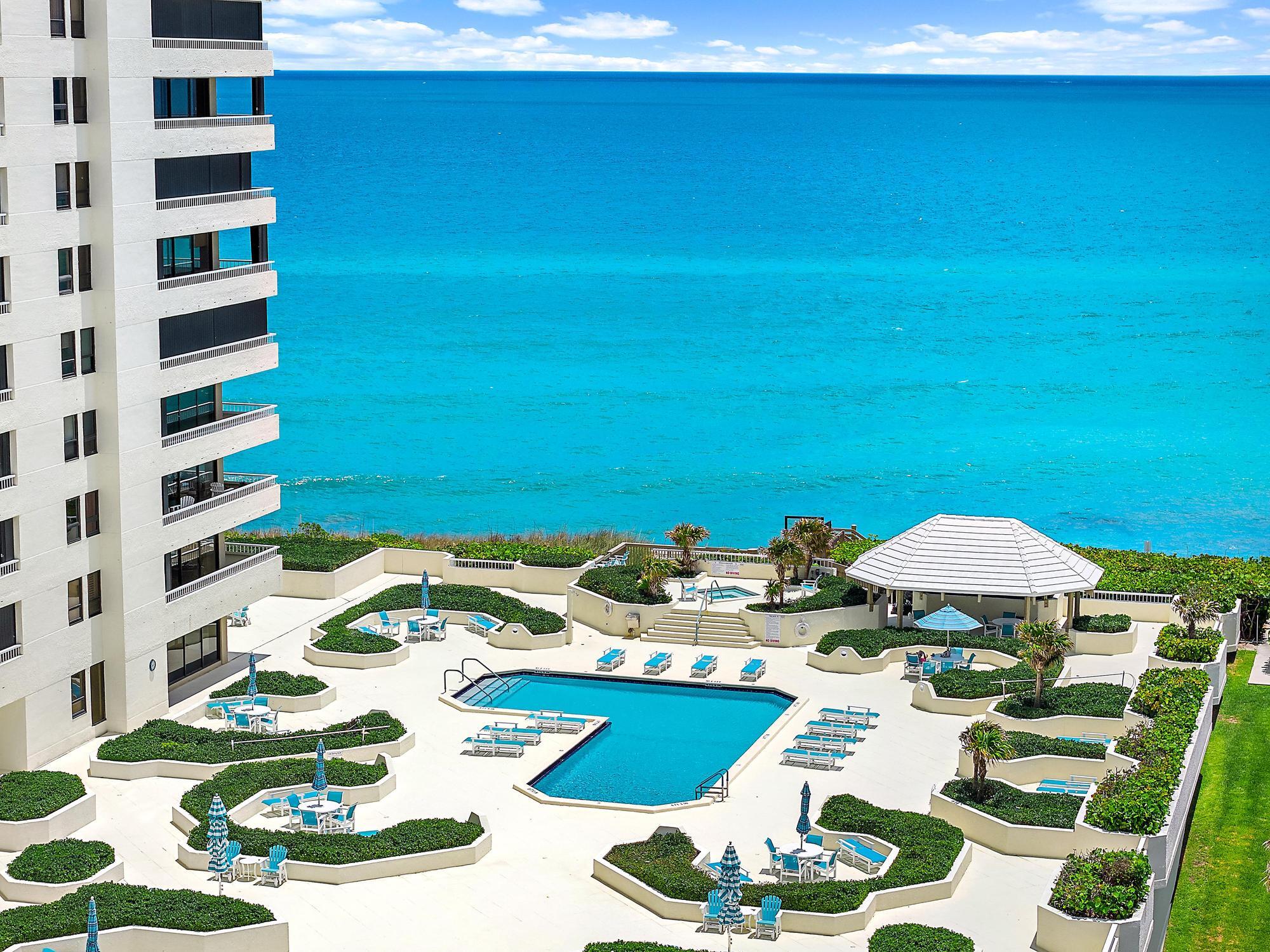 At the prestigious Reaches on Singer Island, this corner unit captures the essence of luxury coastal living with breathtaking panoramic views and the mesmerizing Bahama blue waters stretching endlessly in every direction. Floor-to-ceiling glass fills the home with natural light, showcasing expansive ocean and coastline vistas from nearly every room.  Designed for both elegance and relaxation, the spacious layout offers seamless indoor-outdoor living with oversized balconies perfect for sunrise coffee or sunset entertaining. The Reaches is known for its private beachfront setting, resort-style amenities, and exclusive atmosphere, creating a true sanctuary in the sky.  Wake up to the sound of the waves, enjoy endless turquoise horizons, and experience the unparalleled beauty of Island living