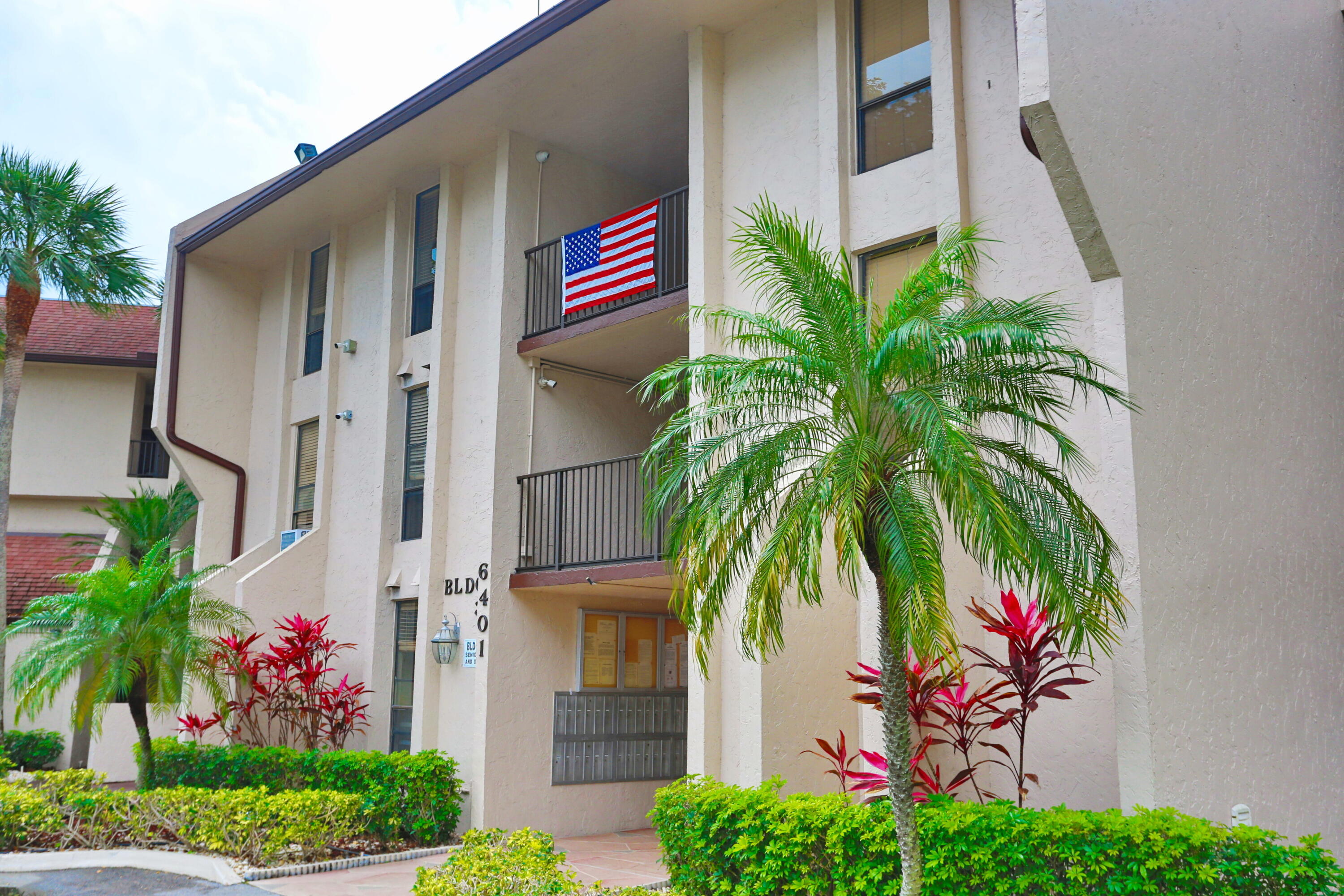 Looking for a cozy condo with a beautiful view? WELCOME HOME! This 2 bedroom, 2 bathroom condo in a 55+ community is the place for you. Ideally located near the elevator and directly across from the common laundry, the unit also offers washer/dryer hookups so you can install your own. Just two blocks from a pharmacy, grocery store, banks, fast food, and the hospital, with easy access to the Florida Turnpike and Sawgrass Expressway. Features include a newer A/C, no carpet, a kitchen with pass-through, and hurricane accordion shutters. Enjoy your morning coffee or evening sunsets from the spacious west-facing screened balcony overlooking the golf course and water. Community amenities include a clubhouse, fitness center, billiards, and three heated pools.