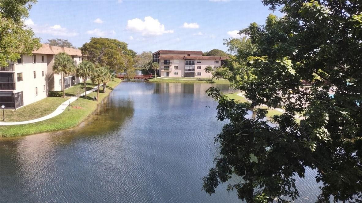 Just sit on your very large balcony and enjoy this gorgeous view of the lake and pool area.  Enjoy a unique 1-mile lighted sidewalk all around lacs for a peaceful and safe walk. All remodeled and tastefully decorated and fully furnished.  This is a turn-key penthouse unit that offers you over 1150 SF of living space you will find enough space to store all your belongings.  Very well equipped kitchen with black granite countertop. New refrigerator, dishwasher, and cooking stove. Brand new full-size capacity washer and dryer in the unit.   Many amenities include 2 heated pools, a BBQ area, Clubhouse, a tennis and pickleball court, a jacuzzi, and a sauna room.  Association says 55+ community.  NO LEASING
