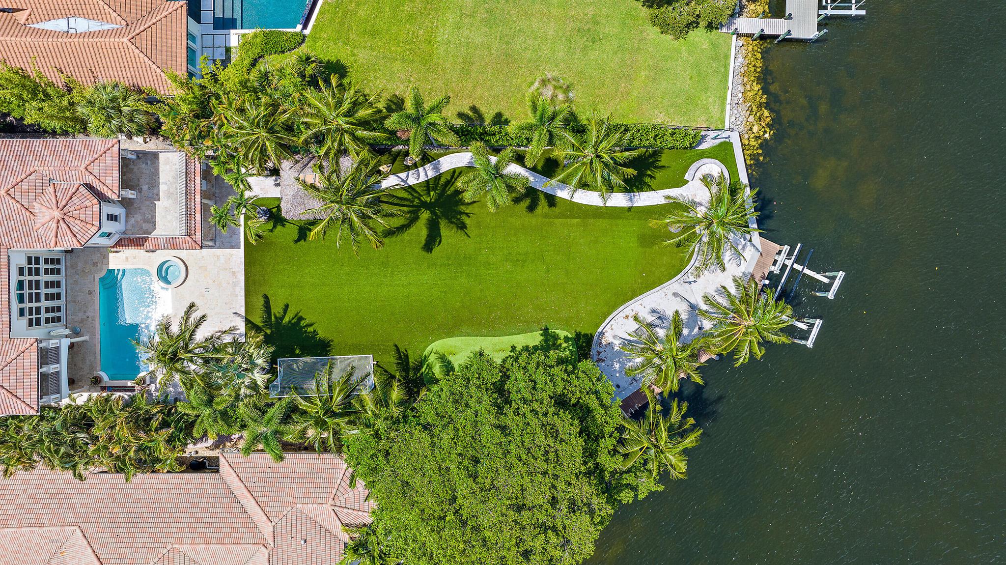 PRIVATELY GATED INTRACOASTAL ESTATE LOCATED IN COVETED PALM BEACH GARDENS WATERFRONT COMMUNITY, INTRACOASTAL PARK.  82' OF DIRECT INTRACOASTAL WATER FRONTAGE WITH NO WAKE ZONE AND NO FIXED BRIDGES MAKE THIS A BOATERS PARADISE.  THIS LIGHT AND BRIGHT MEDITERRANEAN ESTATE WITH FINE CUSTOM APPOINTMENTS IS TUCKED AWAY ON A LUSH, EXPANSIVE LOT THAT BOASTS PRIVACY, SWEEPING INTRACOASTAL VIEWS, A 40,000 PD BOAT LIFT, PRIVATE SANDY BEACH AREA, FIRE PIT, TIKI GAZEBO, LOGGIAS, CABANA BATH AND SECOND FLOOR BALCONIES OVERLOOKING DIRECT WATER VIEWS.  ENJOY THE INTRACOASTAL BREEZE OVER THE PUTTING GREEN, HEATED POOL/SPA AND SUMMER KITCHEN. THIS DEEP LOT OFFERS BEAUTIFUL MATURE TREES, LUSH LANDSCAPING, NEWER TURF AND MORE.  CRESTRON SYSTEM AND GAS GENERATOR.  THIS TRULY IS A REMARKABLE PROPERTY!