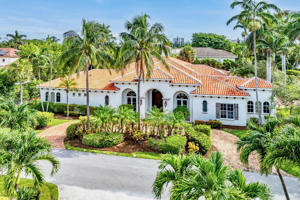 Experience luxury living within the esteemed enclave of The Estates of Spanish River Land. This stunning 2002 single-level concrete block home stands as a masterpiece, boasting an expansive layout of nearly 6,400 square feet under roof and almost 4,500 square feet under air. Positioned on an oversized corner lot measuring 100' x 160', the property encompasses a total of 16,000 square feet, offering ample space for privacy and relaxation. Designed by Carlos Martin, this Southern European-inspired home features soft vanilla stucco, a barrel-tiled roof, and an oversized pool-side loggia. Inside, natural stone flooring, 15-foot high detailed ceilings, and expansive open areas ensure a seamless flow between indoor and outdoor living spaces, catering to the lifestyle of the well-traveled buyer. Throughout the home, voluminous ceilings and timeless Spanish decor exude an air of elegance, sure to enchant even the most discerning buyer. Entertain effortlessly with the expansive 1,000 square foot covered loggia, complete with a fireplace, summer kitchen and cabana bath.

The owner's suite occupies the entire Southern wing, providing unparalleled privacy and generous living space. Dual walk-in closets, dual vanities, a large shower, and a separate soaking tub create a luxurious sanctuary within the home.

Additionally, discover three ensuite bedrooms, each featuring walk-in closets, along with a conveniently located office. The well-appointed kitchen includes a walk-in pantry, butler's pantry, island with prep sink, double wall oven, full-size built-in freezer and refrigerator, and a charming breakfast nook.

This home is a testament to exceptional design and meticulous craftsmanship, transporting you to a realm where sophistication and charm meet at every turna residence perfectly suited for both indoor and outdoor entertaining.

DISCLAIMER: Information published or otherwise provided by the listing company and its representatives including but not limited to prices, measurements, square footages, lot sizes, calculations, statistics, and videos are deemed reliable but are not guaranteed and are subject to errors, omissions or changes without notice. All such information should be independently verified by any prospective purchaser or seller. Parties should perform their own due diligence to verify such information prior to a sale or listing. Listing company expressly disclaims any warranty or representation regarding such information.
