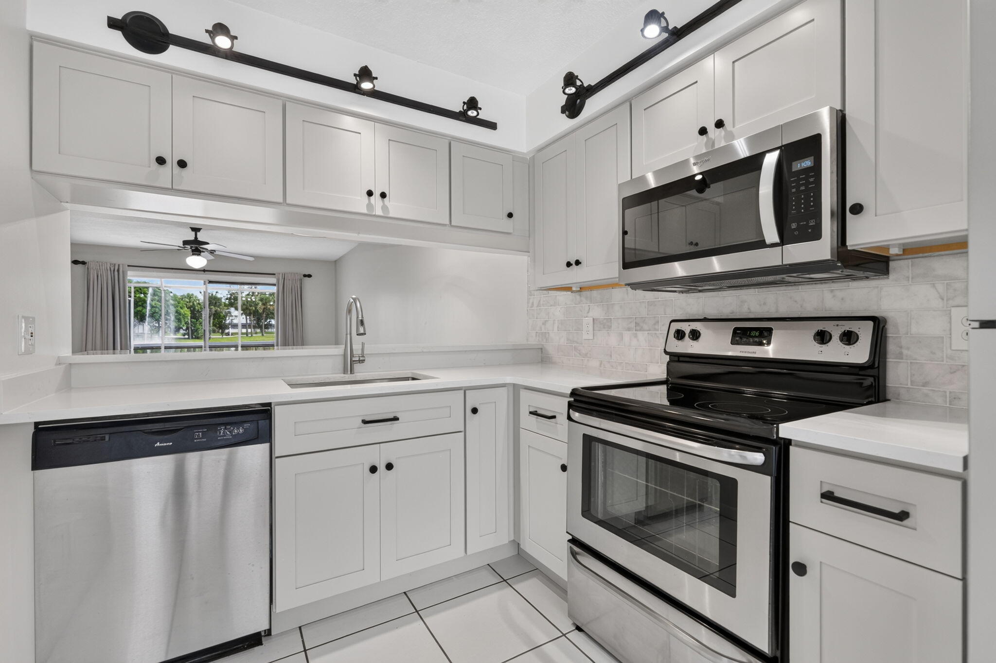 Live the Jupiter lifestyle in this beautifully updated 2-bedroom, 3.1-bath townhome! Kitchen featuring quartz countertops, custom cabinetry, designer lighting & stainless-steel appliances with the same upgrades to the beautifully renovated baths. Enjoy peaceful lake and fountain views from your private screened patio & primary bedroom. Community amenities include 3 pools, tennis, pickleball, volleyball, a boat ramp, and storage for kayaks and boats (18'-23') on a first-come, first-served basis. Ideally located near Jupiter's beaches, waterfront dining, shopping, and golf. The perfect blend of comfort, convenience, & waterfront recreation! Parking Space #5