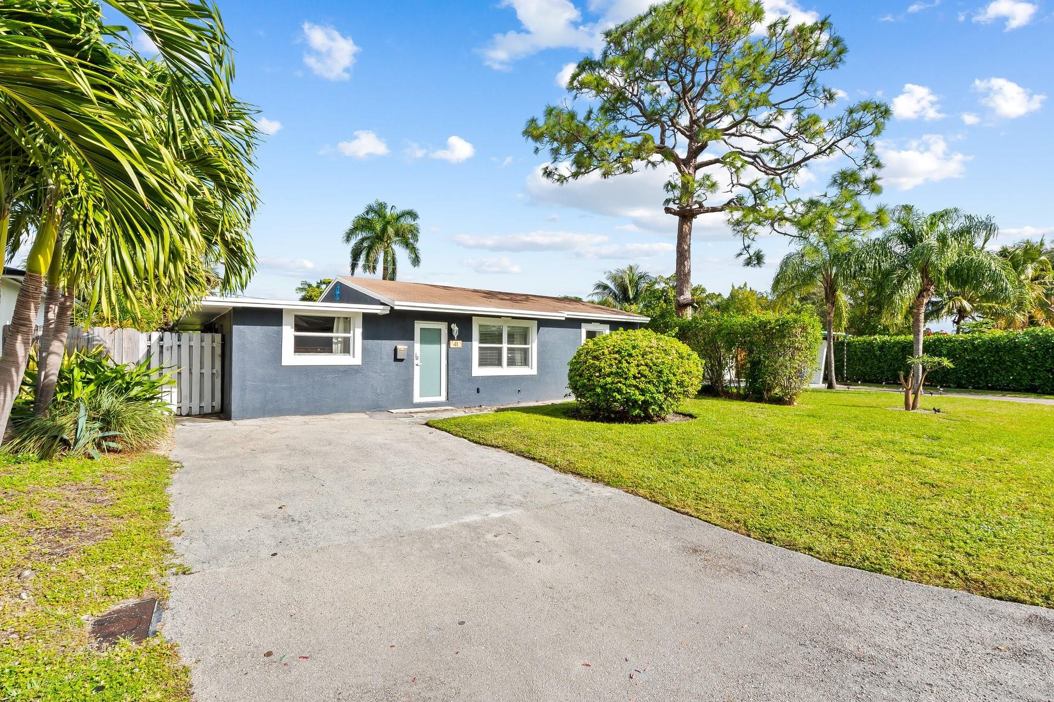 Light, bright & updated 3 bed/2 bath single-family home in desirable North Andrews Gardens! Features include HURRICANE IMPACT WINDOWS, split bedroom floor plan, new wide-plank LVP flooring throughout, updated bathrooms, and an open kitchen with stainless steel appliances and full glass tile backsplash. Spacious Florida room offers flexible living space perfect for a den, dining area, or home office. 2012 roof, 2023 AC w/ smart thermostat, and 2019 water heater. Large fully fenced backyard with plenty of room for a pool, plus storage shed with side-by-side washer/dryer. Prime location with easy access to I-95, shopping, grocery stores, restaurants, downtown Oakland Park, and just 3 miles to the beach! FEMA Zone X - no flood insurance required by lender.