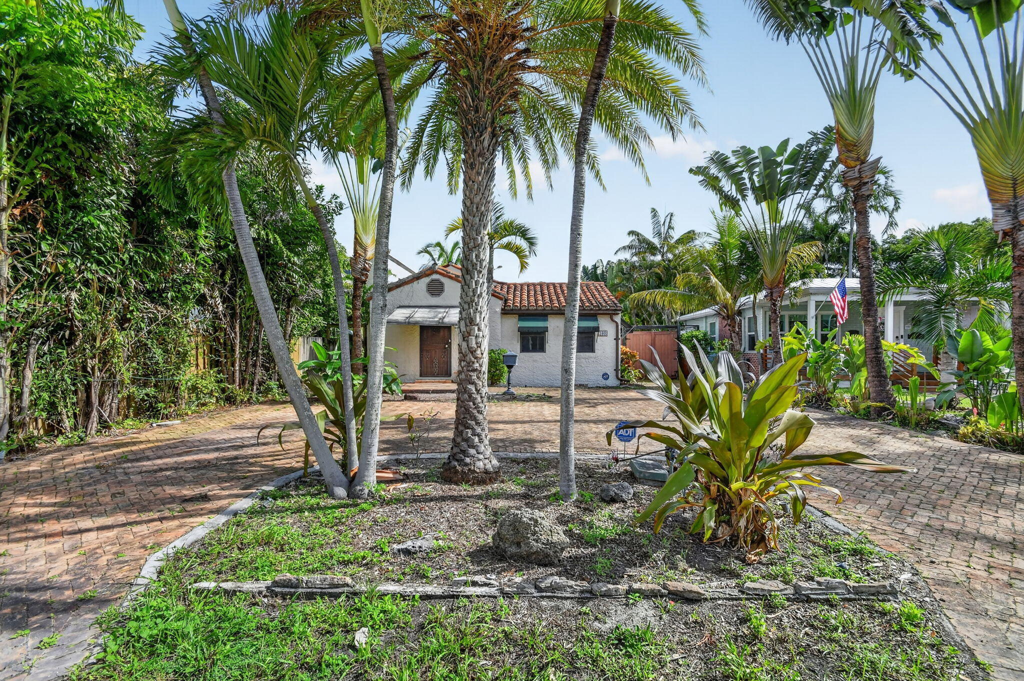 Located just 8 blocks north of Delray Beach's vibrant Atlantic Avenue and only 2 miles from the ocean, this exceptional property offers an outstanding opportunity in one of the area's most desirable locations.  Situated on a generous 7,501 square foot lot (50' x 150'), the property features a private backyard with a beautiful pool and mature trees that create a peaceful, secluded setting. The existing 2 bedroom, 1 bath home presents endless possibilities renovate, expand, or create the custom home you've always envisioned. Enjoy the convenience of being just minutes from Atlantic Avenue's renowned shopping, dining, entertainment, Old School Square, Crest Theatre, and all that historic downtown Delray Beach has to offer. There is no HOA, providing flexibility and freedom for homeowners and  and investors alike.