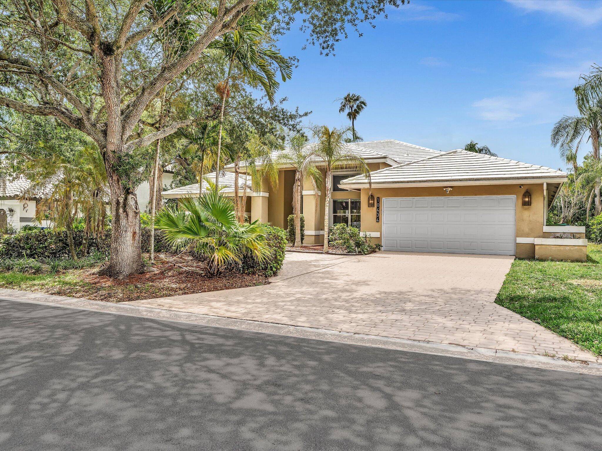 Beautifully updated waterfront pool home in the highly sought-after Glen Oaks community of Coral Springs! This spacious 4-bedroom, 3 full bathroom CBS residence offers a desirable triple-split floor plan, soaring vaulted ceilings, abundant natural light, and an open-concept layout designed for comfortable living and effortless entertaining. The oversized kitchen with stainless steel appliances and bar-top seating flows seamlessly into the family room with a cozy wood-burning fireplace. Enjoy tranquil canal views from your private heated pool and expansive backyard. Features include a 2-car garage, indoor laundry room, accordion shutters, circular driveway, and generously sized living areas throughout. Located in an A-rated school district close to parks, shopping, dining, and highways Spacious triple-split floor plan offering privacy and functionality for the entire household. Vaulted ceilings and expansive living areas create a bright, open atmosphere filled with natural light. Enjoy peaceful waterfront views and a heated pool perfect for year-round entertaining. Additional highlights include a wood-burning fireplace, indoor laundry room, circular driveway, accordion hurricane shutters, and a spacious 2-car garage. Located in the desirable Glen Oaks community near top-rated schools, parks, shopping, dining, and major highways. Ideal for both end-users and investors with no HOA rental restrictions.