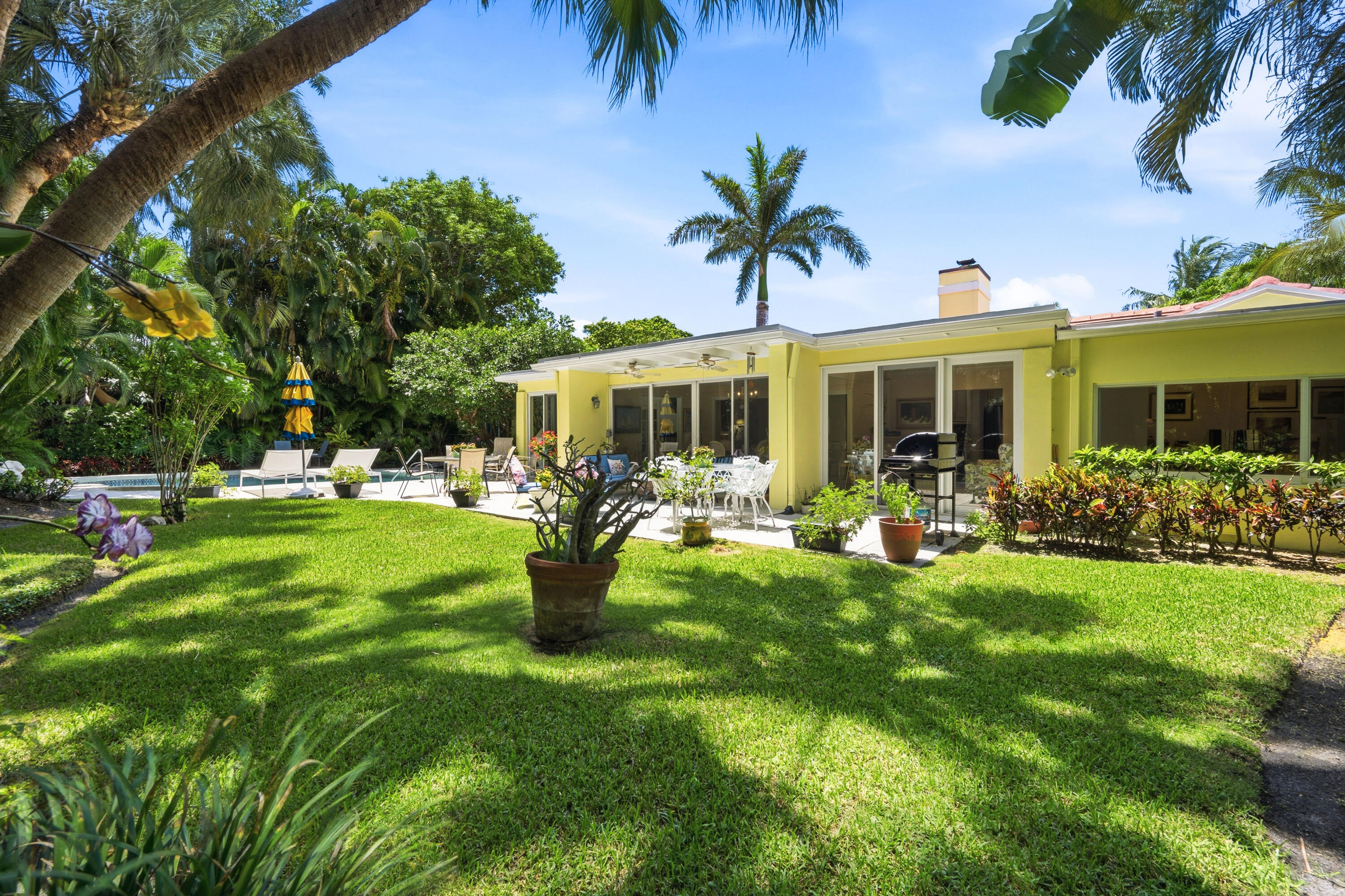 Location, Location Location...This absolutely charming Fairview Avenue 3 BD/3.5 BA home with magnificent garden and pool area is situated on a 11,500 sq. ft. lot just one block South of the Palm Beach County Club, the Beach Club, the bike trail, and just a short drive to Publix and Houses of Worship.  Truly a lovely one-story home in move-in condition with lots of light & fabulous open floor plan for entertaining with easy access to enjoy the gardens & pool area.  Fireplace, crown molding, large office with built-in bookcases, impact doors, newer roof, & one car garage too Must See!
