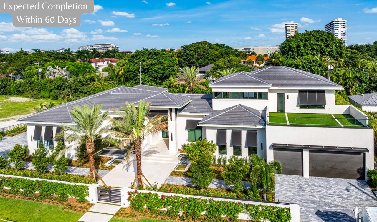 *Expected Completion within 60 days* introducing 1216 Spanish River Road, a prestigious Sea-Side Generational Estate poised to captivate the market with an anticipated completion Early Fall 2024. Nestled within the exclusive Spanish River Land, this Gated Estate occupies the most enviable oversized homesite, spanning an impressive .56 acres of meticulously planned home and grounds. The new home's  Coastal Contemporary Design showcases a sophisticated blend of coastally influenced finishes and understated contemporary elegance built by Skymar Custom Homes.  

The residence boasts a thoughtfully crafted floor plan encompassing more than 11,500 Total SQFT  living space, including the 5-car air conditioned garage as well as the expansive covered Loggias and balconies. Highlighting 7 Bedrooms, 6.2 Bathrooms, and versatil flex spaces, the layout maximizes functionality, comfort, and privacy. 

Upon Entering the Gated Property, you are greeted by a stunning Garden front entrance and serene fountains taking full advantage of the ample homesite. Once you enter through the 10-foot front door you are greeted by a Grand Formal Gallery with bespoke architectural millwork. The Foyer is one of many impressive vantage points of the property. With east-facing windows curated to captivate the picturesque resort-style backyard and breathtaking sunken fire lounge. Adding to the appeal of the Foyer you will notice the marble wine wall and bar within the Club Room where your guests will enjoy west facing windows overlooking the front garden and fountain feature and east-facing windows overlooking the estate's backyard, truly a sophisticated entertaining space. 

The kitchen showcases two generously sized islands finished in quartzite with waterfall edges complemented by top-tier Miele appliances and a PITT cooktop flooded with natural light from its tremendous south facing window wall. The hidden butler's pantries and catering kitchen offer a full second set of Miele appliances, creating an efficient and clean environment for entertainment and a private space for staff to prep, serve, and clean for daily and holiday gatherings.  

Indulge in the Sumptuous living spaces on the first floor tailored for relaxation, including the gym/movie theater, library/office ensuite, and large formal dining area with fountain and fire lounge views. Immerse yourself in carefully selected finishes, featuring Symphony brand extra wide white oak Flooring, brushed gold fixtures featuring Jaclo, Toto, and Kohler, and a bespoke millwork package.  

The Primary Suite offers a tranquil sanctuary with a lavish bathroom, featuring floor-to-ceiling illuminated textured natural stone, travertine marble, large Airjet tub, a spacious double-shower as well as his and her commodes. Step outside into your private Zen Garden retreat, a true first-in-class extension of your primary bathroom giving you privacy but connection to nature with an outdoor shower, reflexology pebble floor and seating area. The primary suite's retreat boasts panoramic views of the pool, spa and garden and is one of many special locations in the home. 

The elevator opens to the second level which features a coastal inspired second family room with wet bar, and three en-suite bedrooms, one of which is the VIP suite, bath and massage room with serene views to the east. Additionally, there is a creative reading nook which integrates nicely with the lower level's breakfast area. Sunrise and sunset balconies offer residents the choice to salute the morning sun or watch the boats skim the Intracoastal's surface across the street.   

Privacy is paramount in the East Facing Backyard, bathed in the morning sun and offering shaded afternoons, the courtyard creates an idyllic setting for the resort style pool, sunken fire lounge, and heated spa. Enjoy sun-kissed mornings on the sundeck or the 1,000 sqft covered loggia with custom summer kitchen. The pool design mimics an "over-the-water bungalow" experience with sundecks, stepping-stones over the water, and water radius edge around the fire lounge.  

Adding to the allure of the backyard, your guests will relish their own cabana bungalow positioned on the edge of the pool and sundeck. A generously sized bedroom suite with a well-equipped morning bar and luxurious bathroom ensures a comfortable stay within the grounds of this Estate. 

Possessing thoughtfully curated natural stone, warm wood tones, mixed metals and Control 4 smart home features professionally designed by an award winning team of design professionals, 1216 Spanish River Road is unparalleled in its grandeur and nuanced coastal elegance, nearing completion. Join us for an exclusive private viewing of this extraordinary legacy estate. 

Developers fee of 1.5% to apply. Disclaimer: The information published & provided including but not limited to prices, measurements, square footages, lot sizes, features, finishes, and calculations are subject to errors, omissions or changes without notice. All such information should be independently verified. All parties should perform their own due diligence on pre-construction sales to verify all information.