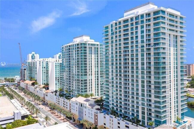 Spacious 2 bed + den, 3 bath residence in sought-after Parque Towers. Features a split-bedroom layout, floor-to-ceiling impact windows, and abundant natural light throughout.    Enjoy a covered balcony with city and water views. Open-concept kitchen with modern cabinetry and high-end appliances, plus en-suite bedrooms and ample closet space.    Full-service building with resort-style amenities including pools, fitness center, spa, valet, and 24-hour concierge. Prime Sunny Isles location just minutes to the beach, Aventura Mall, and dining.