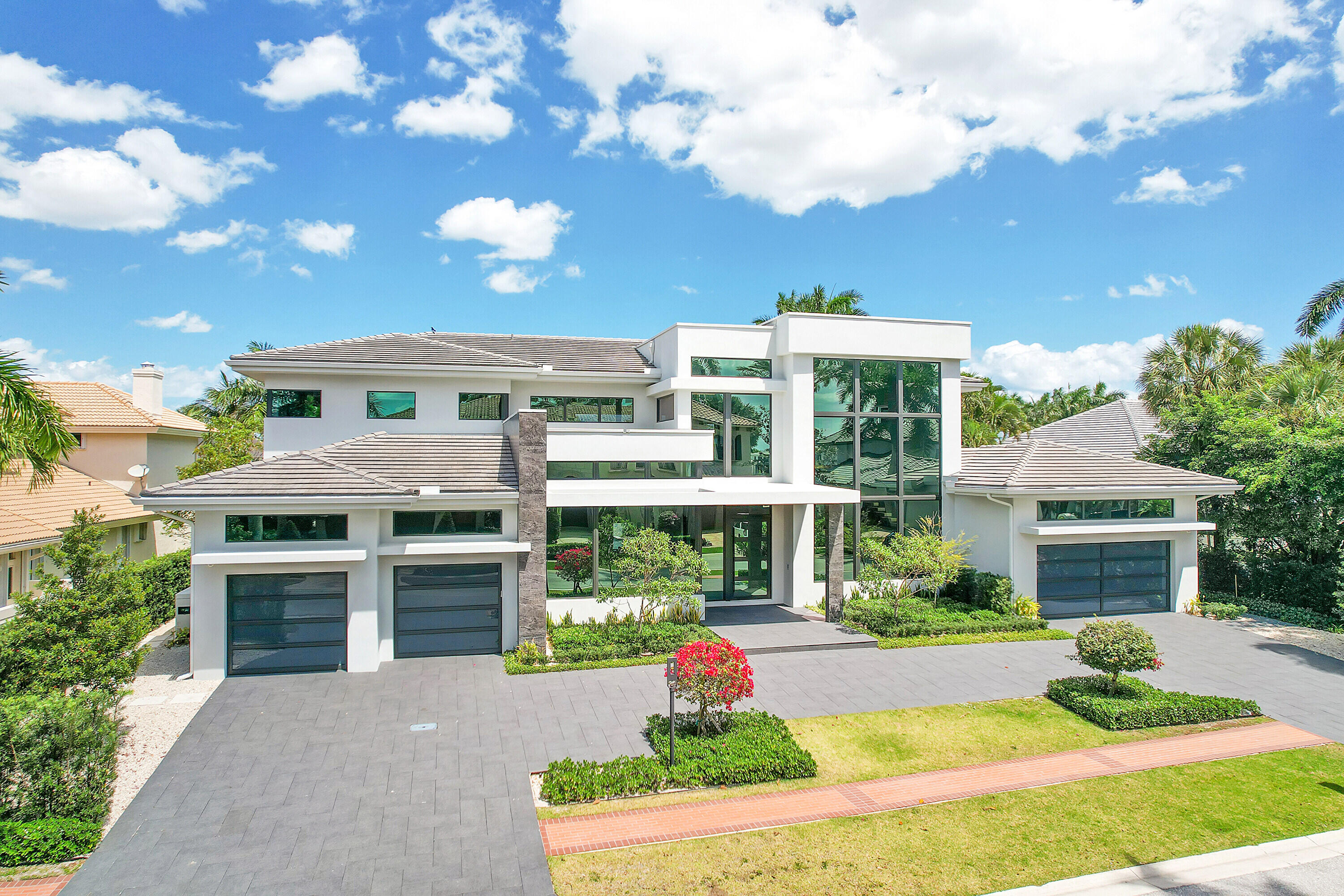 Discover unparalleled luxury in this exquisite home, completed in December 2021 and designed with the utmost sophistication.

The main floor boasts an open floor plan kitchen, family room, and living room as well as an office and a lavish primary bedroom with 2 baths, featuring a shared shower and a luxurious soaking bathtub. A hidden drop-down TV, morning bar, and Tonal exercise machine create a private oasis.

Ascending to the second floor reveals four ensuite bedrooms in two wings, ensuring privacy and convenience. The innovative Trackman Golf Simulator room doubles as a movie theater or a potential sixth bedroom.

This home offers seamless living with both upstairs and downstairs laundry rooms, custom closets throughout, and an elevator for easy accessibility. Enjoy peace of mind with a full house generator, smart home features controlling music, lights, and security, as well as Somfy controlled shades, including blackout and solar options in the primary suite.

Stay connected and secure with indoor and outdoor cameras, while the 5-zone air conditioning system ensures optimal climate control. The property features a 4-car garage and a water vapor remote-controlled fireplace.

Step outside to the Phantom Screen Patio, featuring an outdoor TV and gas fireplace, offering a perfect blend of indoor-outdoor living. Relax in the saltwater pool and spa, complemented by a soothing waterwall, or entertain guests in the summer kitchen equipped with a refrigerator, icemaker, and grill.

Marvel at the panoramic views overlooking Championship Hole 8, enhancing your outdoor experience. With a total of 9613 square feet, including 7809 square feet under air, this home provides ample space for luxurious living.

All furniture and TVs are available, making this home move-in ready for those seeking the pinnacle of elegance and convenience. Seize this opportunity to own a residence where every detail is meticulously crafted for a life of unparalleled comfort and style.