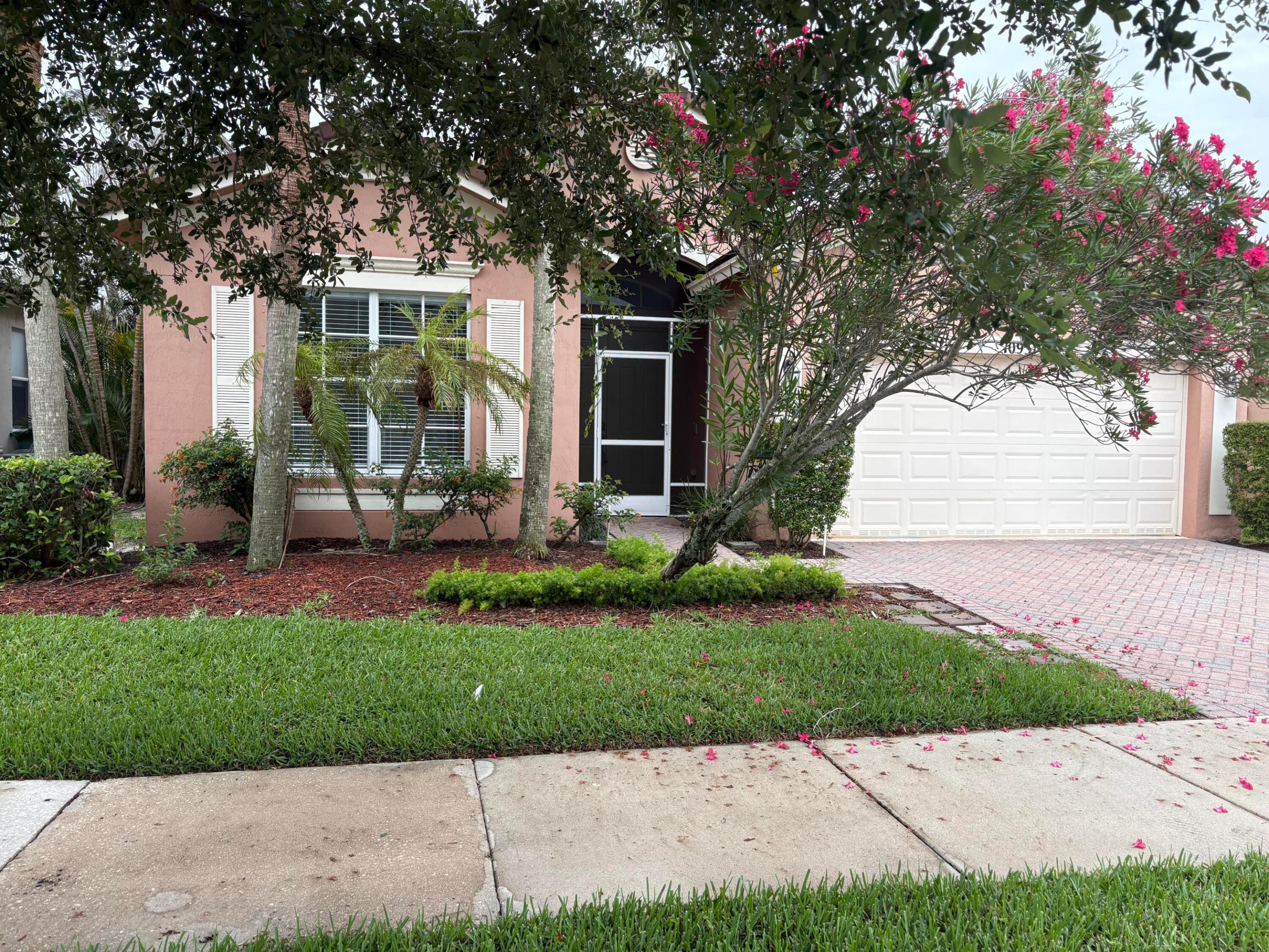 1868 sq.ft CBS Lake Front Home with great Water Views. 3-beds, 2-baths, 2 Car Garage. High Ceilings, Elegant Laminate Floor throughout the main living areas and 20" tile in bathrooms The kitchen has SS appliances and lots of counter space. The  master suite includes two Large Walk-in Closets, Dual Sinks & Vanities, a Separate shower, & Tub. Step outside to the covered, Screened Porch, where you can unwind while enjoying the Lake Views. HOA fees cover Lawn, Cable, High-speed Internet & Pest Control and more. Just steps away from the Tropical Club House, with Tiki Huts, Gym, pool, Jacuzzi. Don't wait!