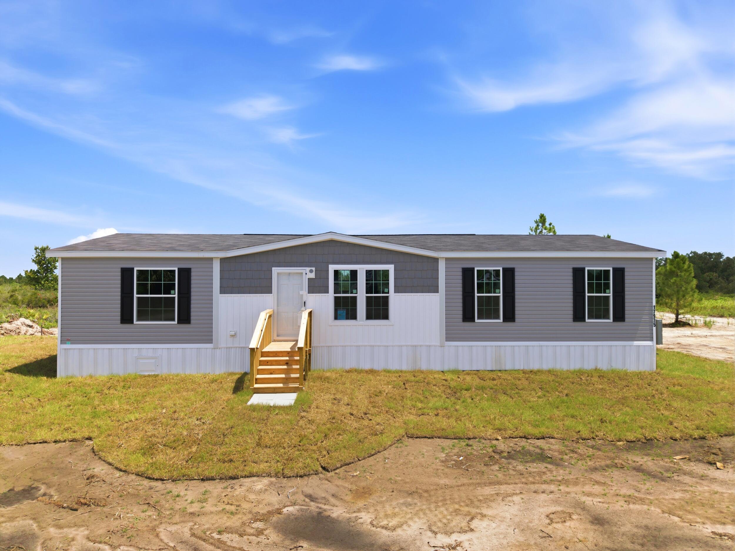 More Pictures coming soon. Escape to the wide-open beauty of The Prairie in Okeechobee with this brand-new Champion Embrace Series home situated on 1.25 acres. Offering 1,493 square feet, this thoughtfully designed home features a desirable split floor plan with 3 bedrooms and 2 bathrooms, providing comfort and privacy for family and guests. The spacious open-concept living area flows seamlessly into the modern kitchen, complete with stainless steel appliances, abundant cabinetry, and ample counter space. The private primary suite includes a large bath with dual vanity sinks and generous storage. Enjoy peaceful country living with plenty of room for outdoor recreation, animals, equipment, or future improvements.  Located in Okeechobee's Prairie area, known for its expansive grasslands, big skies, and rural lifestyle, this property offers the perfect blend of modern comfort and country freedom.