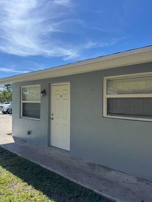 Completely remodeled 1-bedroom, 1-bathroom + spacious living room unit is now available for immediate move-in. New kitchen and bathroom, new hurricane-impact windows, all new appliances, and freshly painted. Close to Downtown Lake Worth and located 10 minutes from the beach. It has a private fenced backyard and an additional utility/storage room at the back with a separate entry. Private driveway shared only with the other unit. Each unit gets two parking spaces.