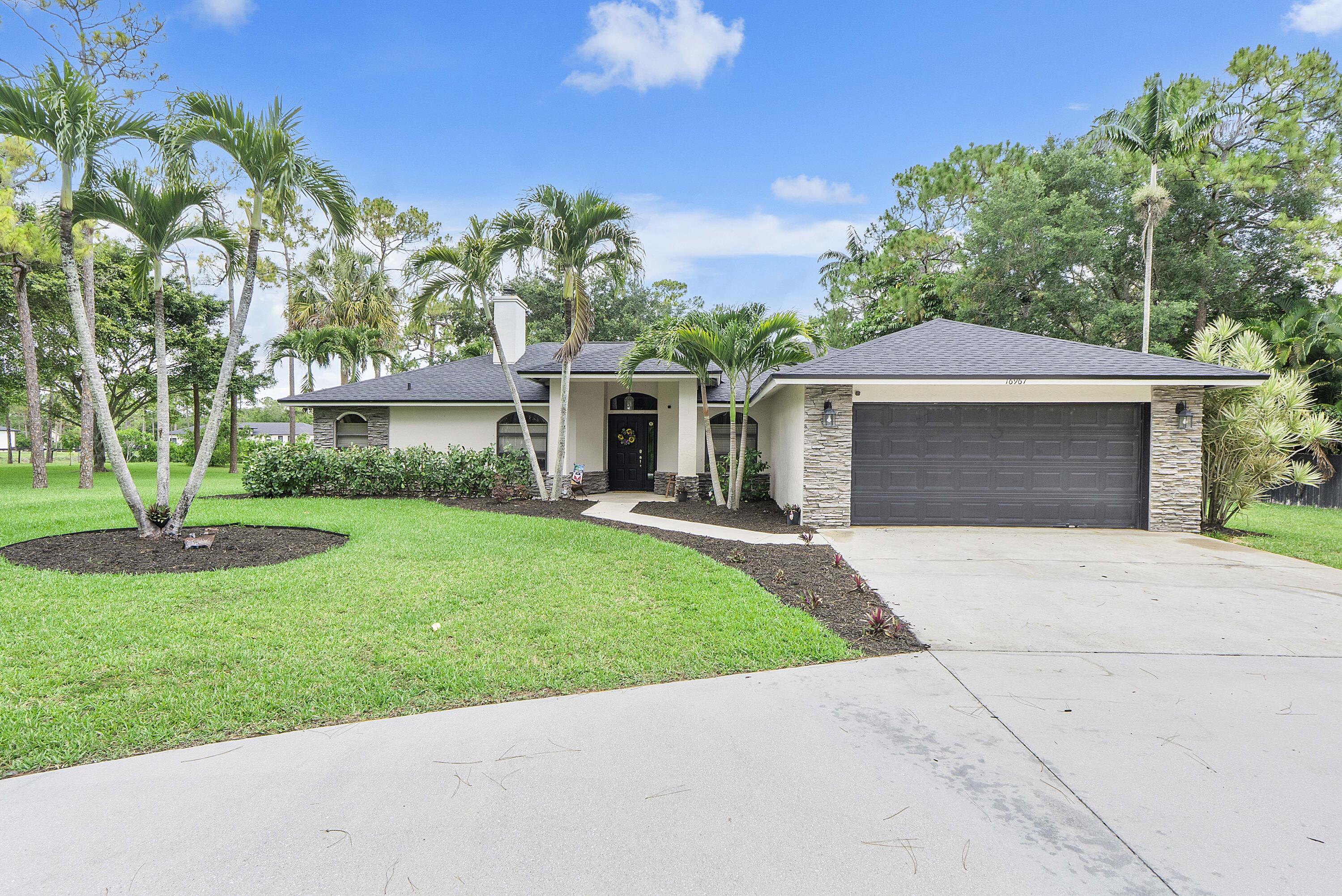 Impeccably maintained CBS pool home on a breathtaking 1.63-acre fully fenced lot backing the 170th canal. This move-in ready 3BR/2BA/2CG retreat offers privacy, charm, and functionality with a screened pool & jacuzzi, relaxing sauna, wood-burning fireplace, oversized fire pit area, and versatile 2-stall barn/storage building. Upgraded kitchen features granite countertops & stainless steel appliances, while both baths also showcase granite finishes. Enjoy peace of mind with a BRAND NEW 2026 roof plus major updates including whole-house reverse osmosis ('19), generator hookup panel, AC air handler ('22), well pump ('23), sprinkler pump using canal water, water heater ('19), and more. A solid, well-cared-for home with no insurance worries.