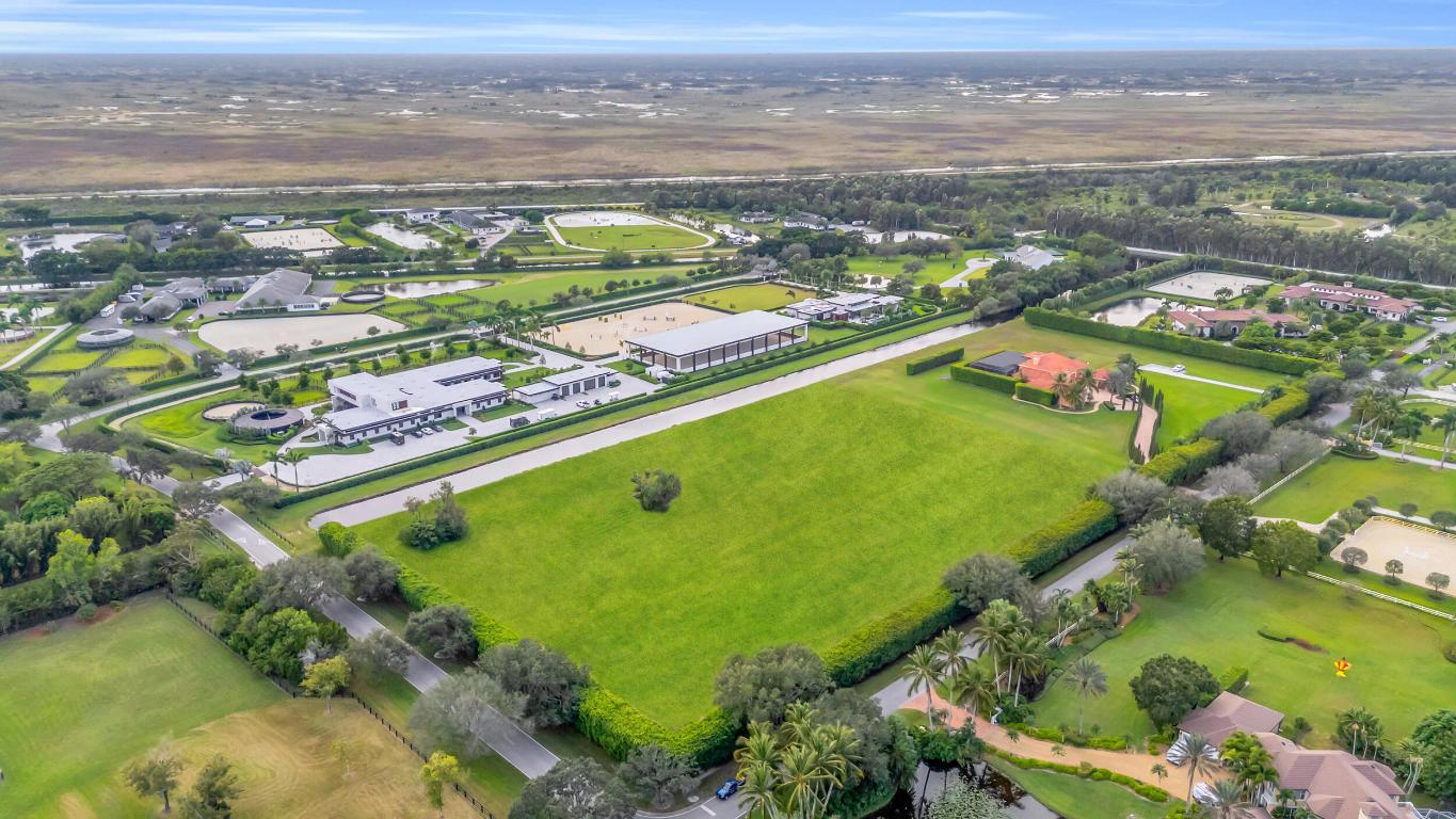Build your Equestrian dream Estate in the exclusive gated community of Palm Beach Point just minutes from the show. Enjoy dual entry access from Palm Beach Point Blvd and Estancia Ln, offering convenient and private entrances for both the residence and barn.
Hack your horse to the show and enjoy the most desired trails in all of Wellington. This 5.54 acre parcel is uniquely situated on a corner lot with plenty of room to build everything you want. DISCLAIMER: All information provided to you regarding this Property has been obtained from third parties such as the Multiple Listing Service, public records and other sources. The Sellers, Realtor and Broker make no representation as to the accuracy of this information. Buyers should perform their own due diligence regarding this Property before executing a Contract for Sale and Purchase for this Property
