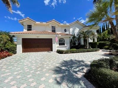EXQUISITE, CUSTOM HOME TUCKED WITHIN A QUIET CUL DE SAC ON  OVER 1/3 ACRE LOT IN PRESTIGIOUS THE ISLES.EXTRAORDINARY DESIGN AND DETAILS HIGHLIGHTS THIS 5 BEDROOMS AND 3 BATHS HOME. ADDITIONALLY,  SPECIAL FEATURES INCLUDE,NEW ROOF IN 2020, BRAND NEW WATER HEATER, BRAND NEW 500 SQ FT BALCONY  DECK AND RAILINGS WITH SPIRAL STAIRCASE OFF THE MASTER BEDROOM WITH IDYLLIC VIEW OF THE POOL AND SERENE CANAL,LARGE MASTER BEDROOM WITH SITTING AREA, NEW GARAGE DOOR,AND HUGE COVERED SCREENED IN PATIO FOR LARGE SCALE ENTERTAINING,THE BACKYARD IS A PRIVATE OASIS BOASTING AN EXPANSIVE YARD WITH FASCINATING SOLAR HEATED POOL AND SPA,METICULOUSLY LANDSCAPE DESIGN WITH MAJESTIC PALMS AND ITALIAN CYPRESS TREES,AND BIG BOAT DOCK WITH PICNIC TABLE, CANAL HAS ACCESS TO LAKE CORAL SPRINGS