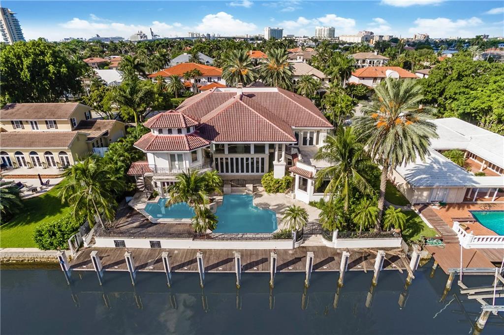 Back on Market. Luxury Waterfront Estate in Prestigious Harbor Beach Fort Lauderdale. Park your mega yacht. 105’ dock & enjoy the pool, spa & summer kitchen. This gated estate has over 8707 square feet with 7 bedrooms, 9 baths, elevator, fireplace, wine room, bar area off pool and spa. Amazing high ceilings and a great floor plan. Private Beach for Harbor Beach residents, security, & Extra dockage available. Best Deal in Harbor Beach. 8 new AC's. See virtual staging photos. Financing available.