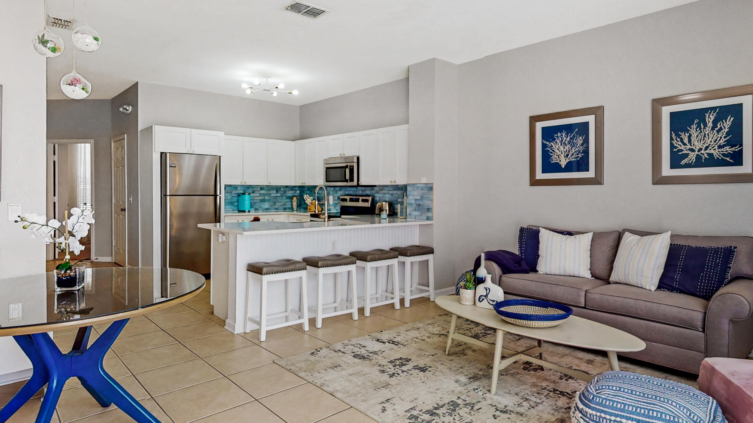 Turn-Key, Fully Furnished & Income-Producing! Beautiful 3BR/3BA townhome in the gated Windsor Hills Resort, just minutes from Disney and major attractions. This well-maintained home features a newly renovated and expanded kitchen with modern cabinetry, upgraded countertops, stainless steel appliances, and added prep space—over $35K in improvements. Recent updates include new water heater (2025), AC (2018), and brand-new roof (2026). Tile flooring throughout the open main level leads to a private screened-in pool with no rear neighbors, perfect for relaxing after long park days. Each bedroom offers its own en-suite bath for privacy and comfort. Resort-style amenities include lagoon pool, water park, clubhouse, fitness center, arcade, theater, sports courts, playgrounds, marketplace, and 24-