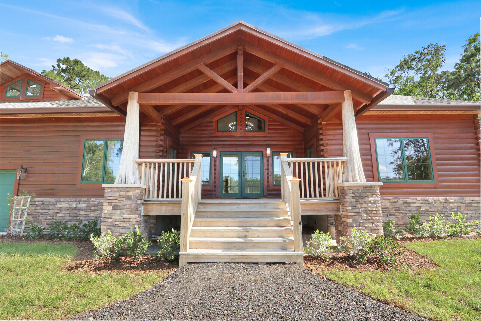 Stunning custom 4BR/3BA POOL home with 2-car garage and nearly 5,000 sq ft under air offering breathtaking views of a 12,000 acre preserve. Built with durable Tidewater Red Cypress logs and concrete construction, this unique home with 20' high ceilings features impact glass windows & doors, gas stove, gas dryer, gas water heater, & whole-house reverse osmosis system. Completely updated in 2026 with the highest quality of workmanship, with spacious upstairs & downstairs living areas plus an 840 sq ft multi-purpose air conditioned room ideal for homeschooling, office, gym, or game room. Located on a paved road, this one-of-a-kind property combines privacy, functionality, and exceptional design in a peaceful natural setting.