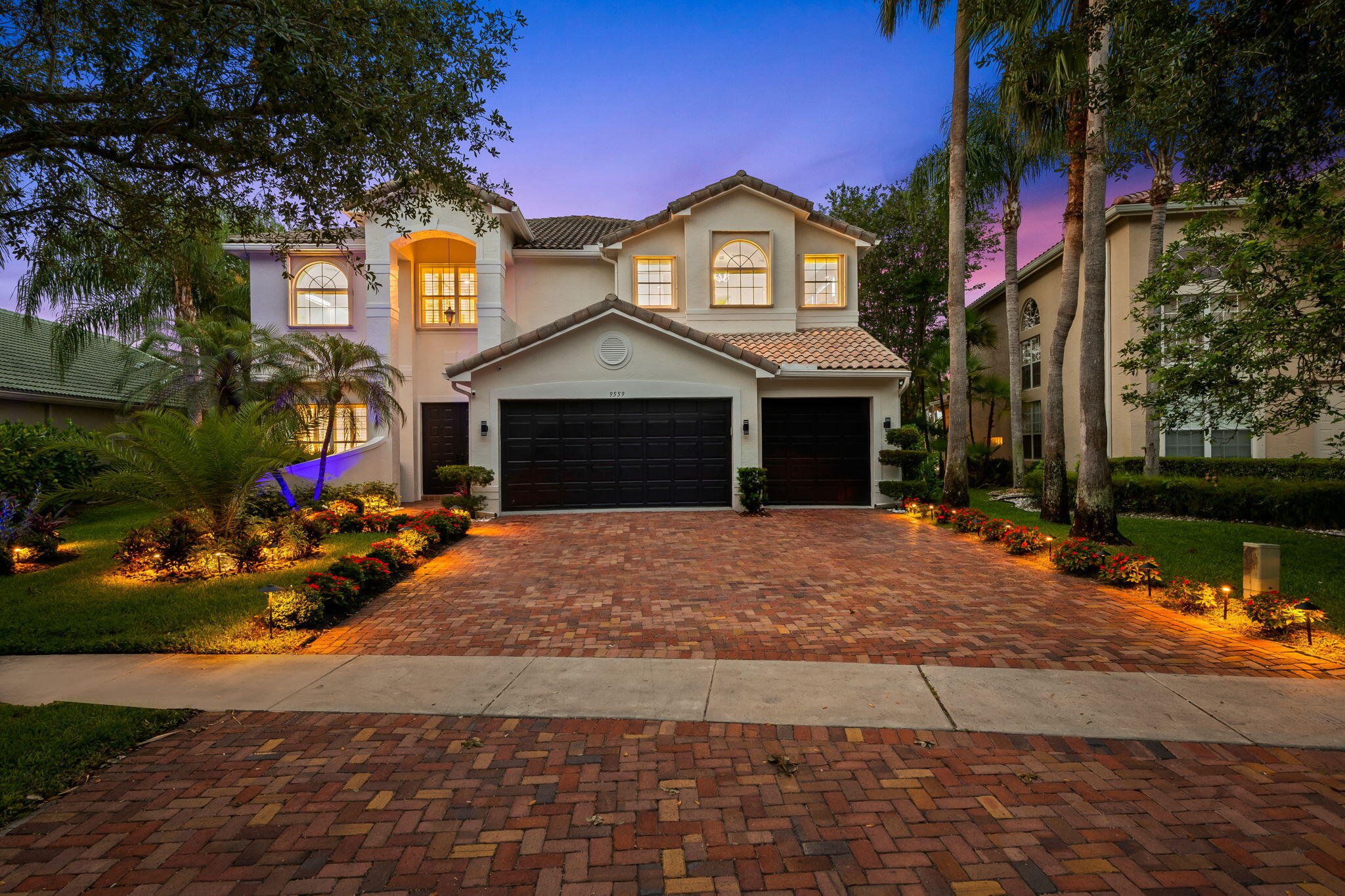 9559 Barletta Winds Pt is a fully upgraded waterfront masterpiece where luxury meets technology. The chef's kitchen boasts granite countertops, two dishwashers, a built-in Bosch coffee maker, and a walk-in pantry. High-end Italian interior doors, porcelain tile floors, custom window treatments, remote-controlled blinds, and state-of-the-art heated self-cleaning toilet seats are found throughout — including a full guest suite and full bathroom on the main floor. A true smart home — lock doors, control lighting, cameras, and more from your phone. Features 16 built-in cameras (interior & exterior), whole-home security system, custom lighting controls, premium speakers throughout the home, and smoke/carbon monoxide alarms connected directly to your phone and the fire department.  Outside, enjoy a brand-new pool system on the water, an expansive upstairs balcony with tile floors, all-new landscaping, front yard night lighting, and a 3-car garage with new tile floors. Major updates include 2 new AC units, new electrical, new plumbing, new high hats, and accordion hurricane shutters. Upstairs features 4 bedrooms — a massive primary suite with an enormous spa-like bath, oversized walk-in closet, and sitting area; two bedrooms connected by a jack-and-jill bath; and a fourth with its own separate bath. Saturnia Isles offers a state-of-the-art clubhouse, pool, fitness center, sports courts, and 24-hour manned gate.