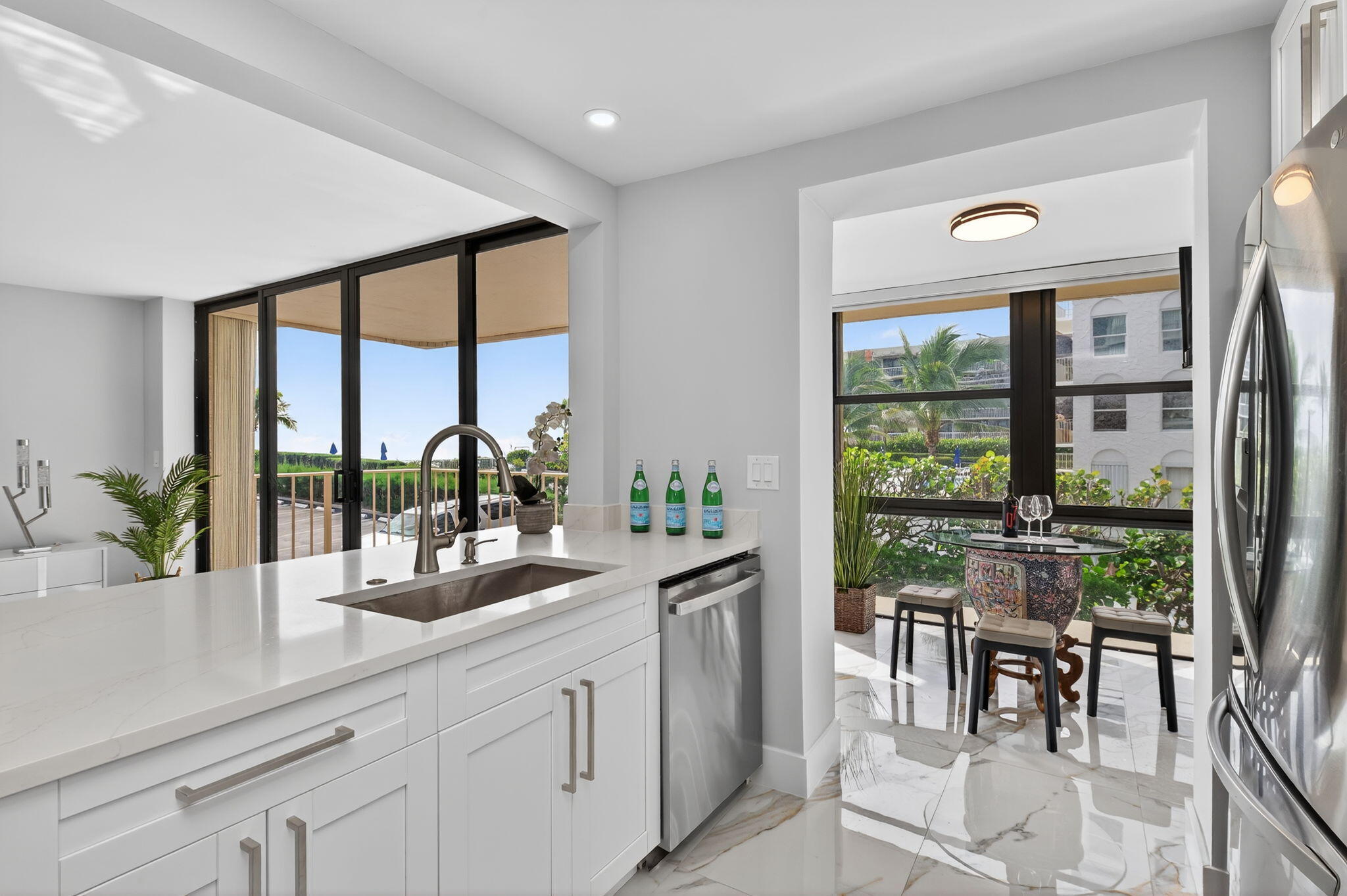 Experience exceptional coastal living on Palm Beach Island in this 2BR/2BA second-floor residence, beautifully renovated in 2025 and ideally located just steps from the pristine beach. Filled with natural light, this home features ceramic tile flooring, quartz countertops, new kitchen and bath cabinetry, and all-new appliances. The desirable split-bedroom floor plan offers privacy and comfort, while the spacious living area, breakfast nook, and private balcony showcase sweeping ocean and Intracoastal views. The primary suite features a custom closet and elegant bath. Additional highlights include impact windows and sliders, new A/C, updated electrical panel, one assigned covered parking space, and a storage unit on the same floor. Onsite management completes this outstanding offering.