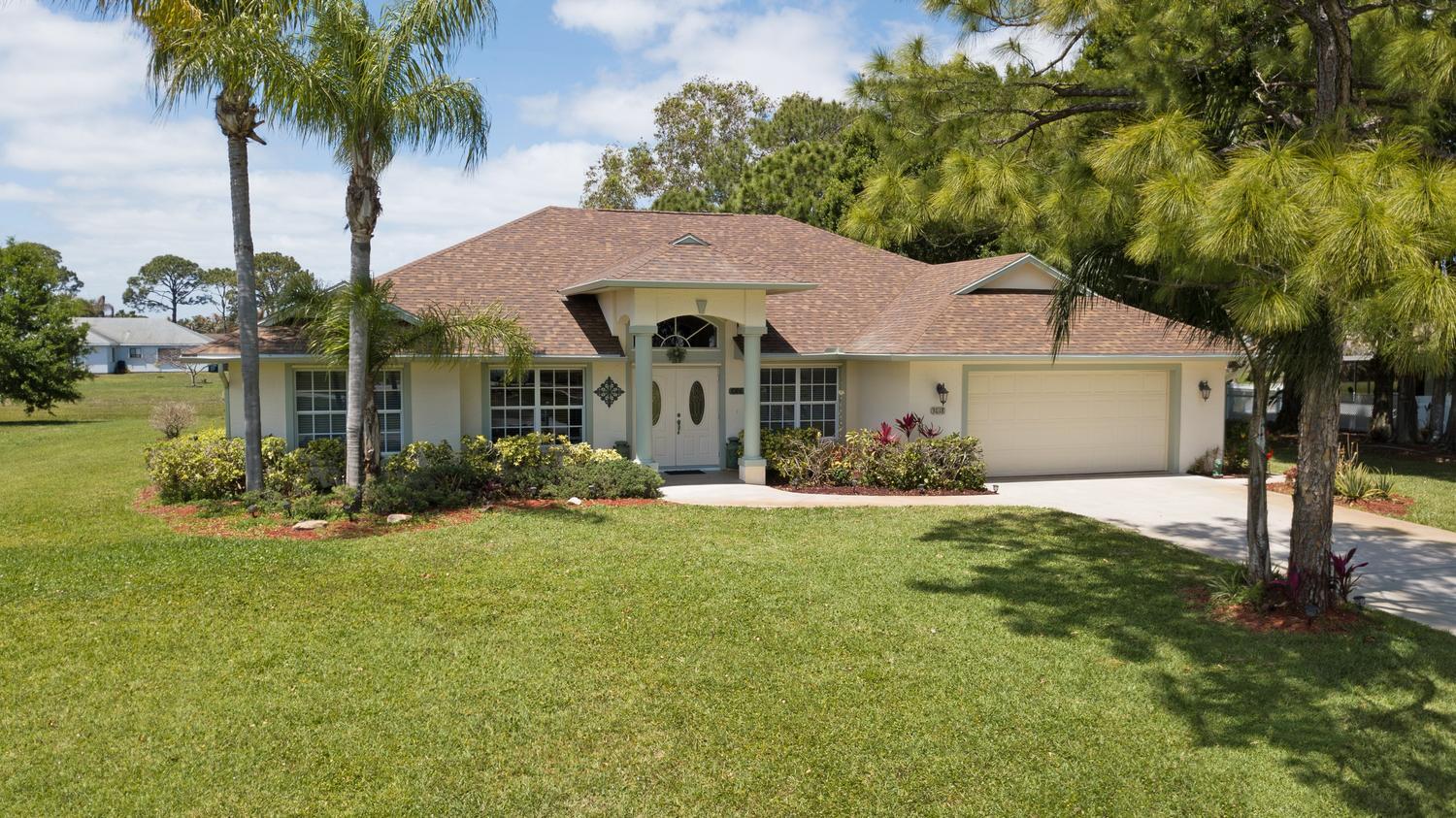 NEW 2026 Roof! Located in The Highly Desirable Sandpiper Bay Community. 2003 CONCRETE BLOCK Home Offers Updated Kitchen W/Granite, Stainless Steel Appliances & Farmhouse Sink, Range W/Air Fryer, Split Plan - 3 Bedrooms With Walk-In Closets PLUS Separate Office/Den, 2 Full Baths, Central Vacuum, Oversized Garage - 528 Sq. Ft. - Park Your Golf Cart. Enjoy Outdoor Living on the Covered Patio. Irrigation System On Well. NO HOA. PARK YOUR TRUCK, BOAT, RV, TRAILER! Home To The Port District & Botanical Gardens River Walk, Canoe/Kayak Launch, Playground. Minutes To Shopping, Dining, Hutchinson Island Beaches, EZ Acess To I-95, Fla Turnpike & Public Transit. Discover Paradise On The Treasure Coast With Top-Notch Water Sports, World Class Golf & The Best In Boating & Fishing.