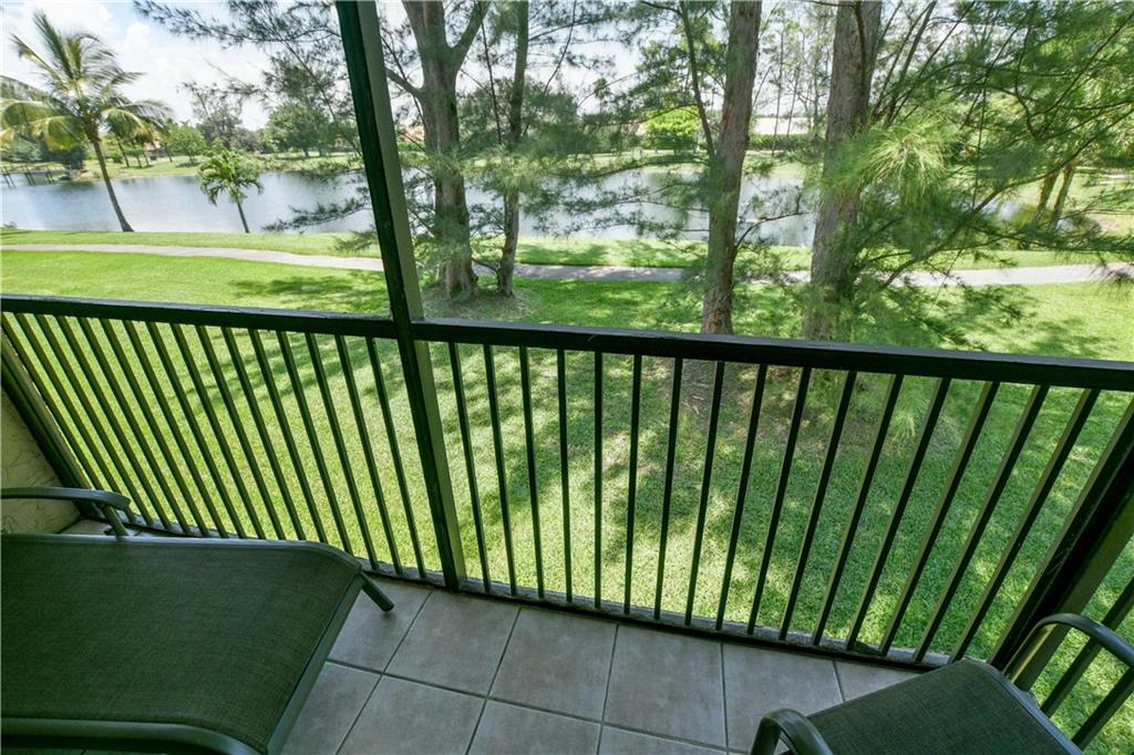 Experience the easy Florida lifestyle in the heart of Boca at an affordable price! Ready for you to move in. Furniture can stay, too! Beautiful 2 bedroom, split plan. Laminate and tile floors throughout. Begin and end your days on the screened balcony overlooking the lake. This home has been lovingly cared for. A/C is only 3 years old. Tankless WH gives you more closet space. DW is only 1 year old. Short walk to the pool. Or, enjoy a leisurely stroll on the walking path around the lake. Terrific schools close by! Walk to Del Prado Elem and nearby shopping. Easy commuting, too.
