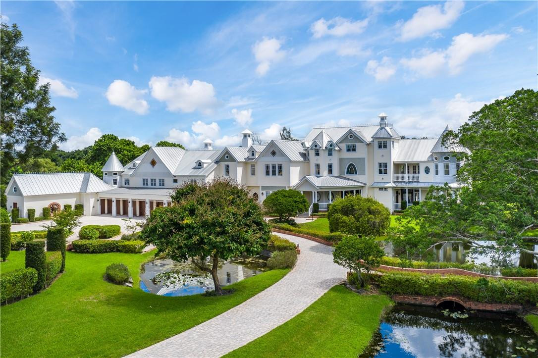 Sunshine Ranches storybook estate is set across 7.2 manicured acres. The spectacular 16,000SF+, 9BR/11fullBA/4halfBA compound represents classic style in every way with sprawling, long winding entrance, gardens, scenic ponds and more. The warm welcome doesn't disappoint with natural light abound, stained glass windows, grand ballroom, two-story gentleman's bar, movie theater, 2-lane bowling alley, dance studio ... the list goes on an on. Outside, take a casual stroll, enjoying everything in the privacy and comfort of your own confines. Walkways, lush foliage and mature trees outline private lighted tennis court, 80x44 freeform resort-style pool and rolling lawns. Private entrance and 5-car garage provide ample security for all the toys and car collection. Simply stunning. Show and sell.