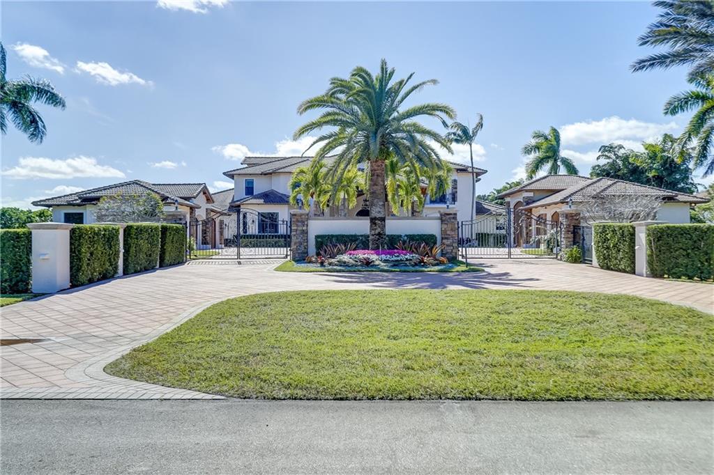 Luxurious Landmark Ranch Estates custom home! One of the larger homes in the area, over 14,000 sq.ft per tax records. Replete with custom millwork & stone work throughout. Enter thru the private gates of this custom estate home into the motor court with a portico fit for a resort, additional parking is accommodated by the ample paver driveway & the 6 car garages. Kitchen boasts top line appliances fit for a chef. Soaring ceilings, millwork and custom cabinetry abound here. The office is spectacular with lots of hidden features. See the attached floor plans for complete layout showing all 8 bedrooms, loft area game center, custom theater room, formal dining, breakfast room and snack counter in addition to the summer kitchen and outdoor dining areas. A must see for anyone seeking the best! Floor plans for both first and second floor as well as 6 car garage plan are attached in supplements.