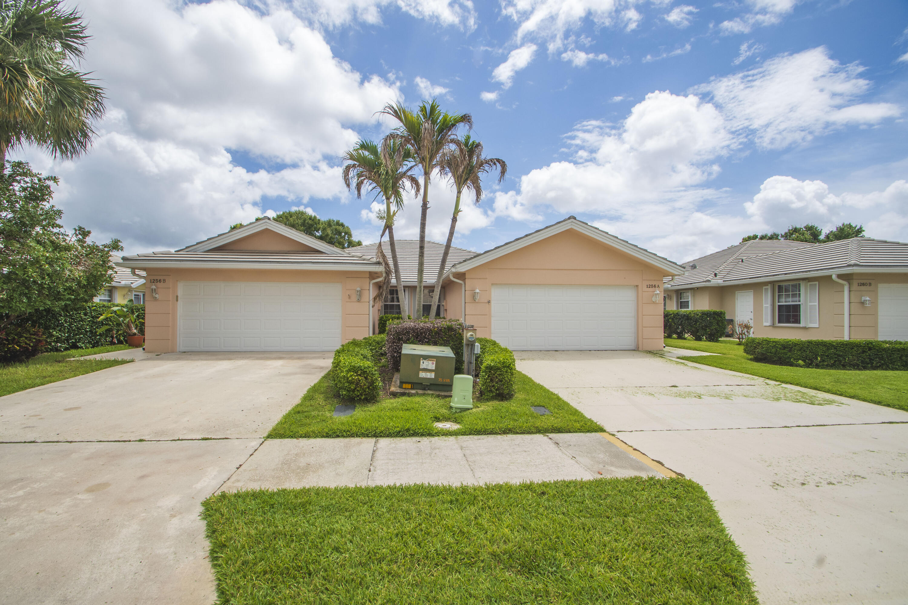 THE HOME YOU'VE BEEN LOOKING FOR!!  This beautifully updated 2-bedroom, 2-bath residence offers peaceful lake views and stylish upgrades throughout. The remodeled kitchen features quartz countertops, brand-new stainless steel appliances, and modern finishes, while both bathrooms and laundry room have been tastefully renovated. New carpet adds comfort to the bedrooms, with tile flooring throughout the main living areas. Relax on the oversized screened porch overlooking the lake and have peace of mind with accordion shutters, PEX plumbing , fresh interior paint, an HOA-maintained roof. Please remove shoes when showing