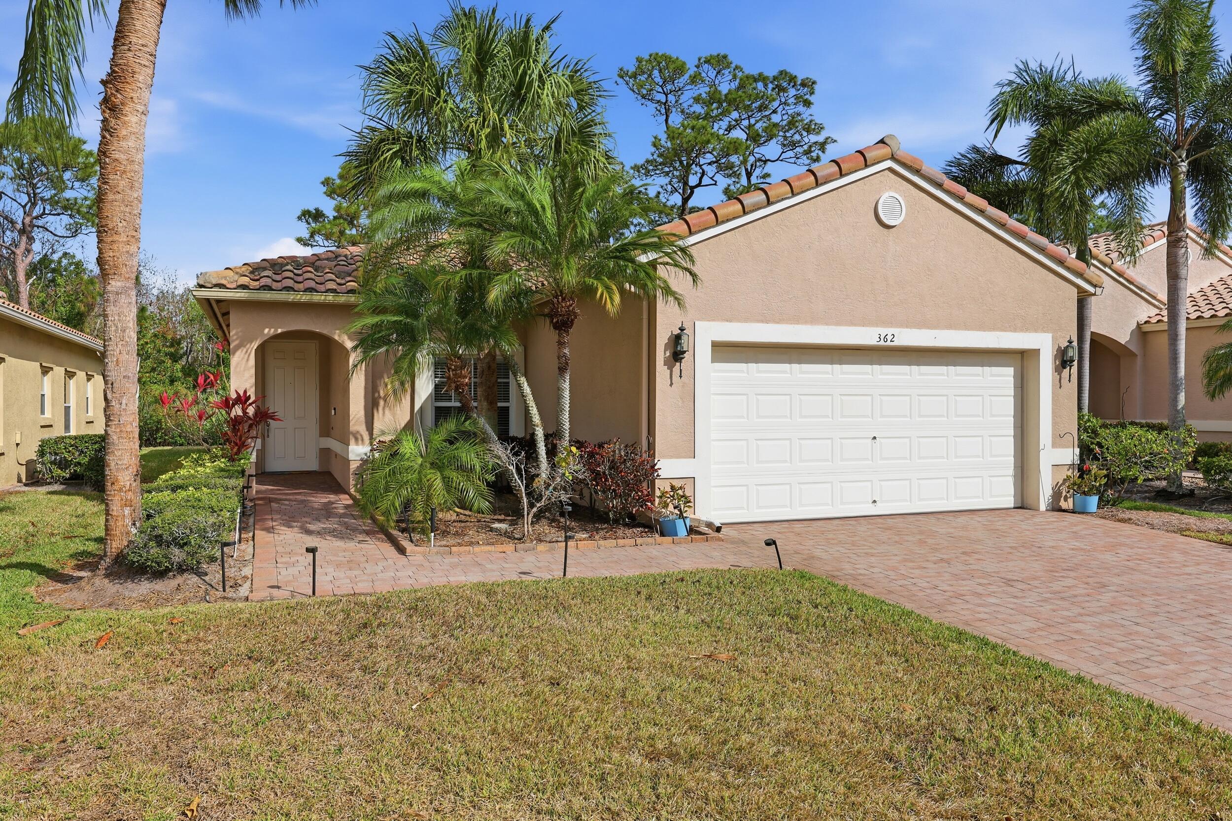 Beautifully updated and backing to a peaceful preserve, this move-in ready home in Cascades at St. Lucie West offers privacy, modern upgrades, and the easy Florida lifestyle you've been searching for. The popular Waterford floor plan features 3 bedrooms, 2 bathrooms, and 1,650 square feet of thoughtfully designed living space with a desirable split-bedroom layout that provides both comfort and functionality.  The centerpiece of the home is the stunning, fully remodeled kitchen featuring over $25,000 in upgrades, including white shaker soft-close cabinetry, marble countertops, decorative backsplash, stylish lighting, and newer appliances. Luxury vinyl plank flooring, fresh interior paint, and modern finishes throughout create a bright, cohesive feel, allowing you to move right in and start  enjoying your new home.  The primary suite offers a true retreat, highlighted by a beautifully renovated bathroom with over $18,000 in improvements, including a floor-to-ceiling tiled shower with dual shower heads, a frameless glass enclosure, dual vanities, and designer lighting. Major updates have already been completed for added peace of mind, including a new AC (2024), water heater (2023), and full home replumbing (2023).  Step outside to your private patio overlooking a tranquil preserve, providing a peaceful backdrop with no rear neighbors, perfect for enjoying your morning coffee, entertaining guests, or simply relaxing while taking in the natural surroundings.  Located in the highly desirable 55+ Cascades community, residents enjoy resort-style amenities including a clubhouse, pool, fitness center, tennis, pickleball, and a full calendar of social activities. Conveniently located near shopping, dining, golf, healthcare facilities, and major highways, this home offers the updated, lock-and-leave Florida lifestyle today's buyers are searching for.